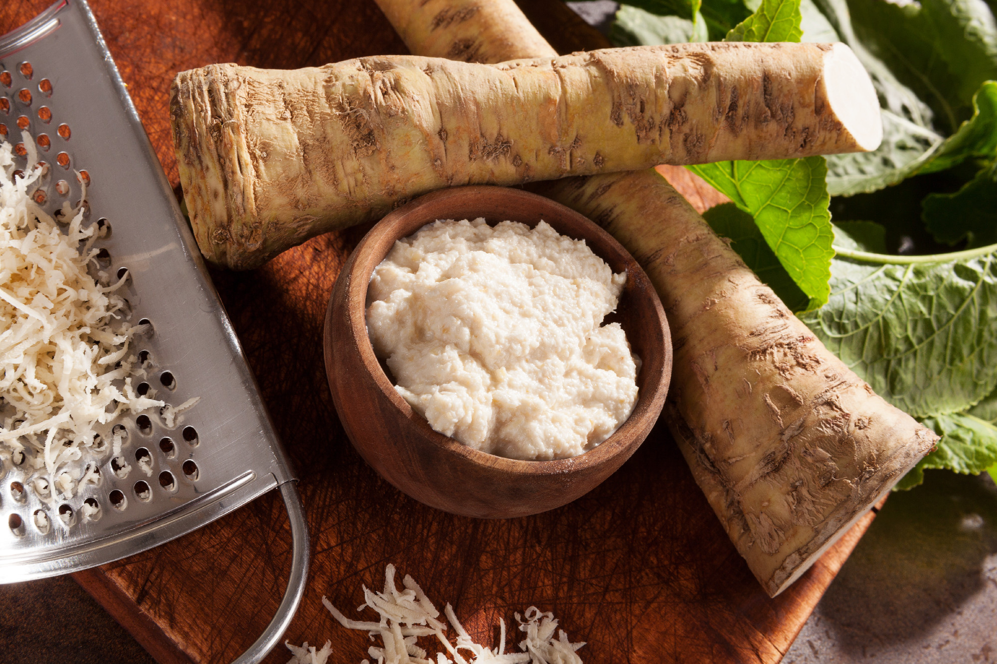 Raw horseradish roots and grated horseradish.