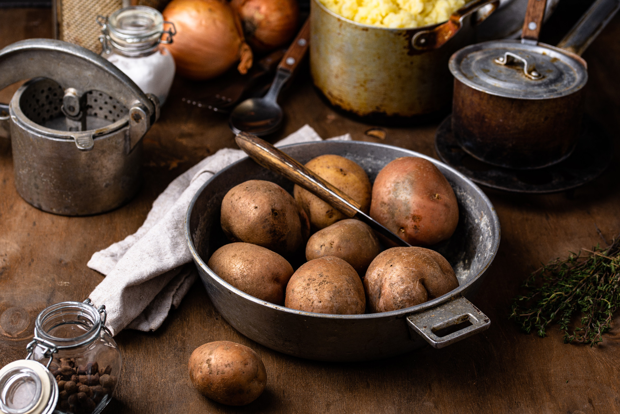 Raw uncooked potato in old vintage pot