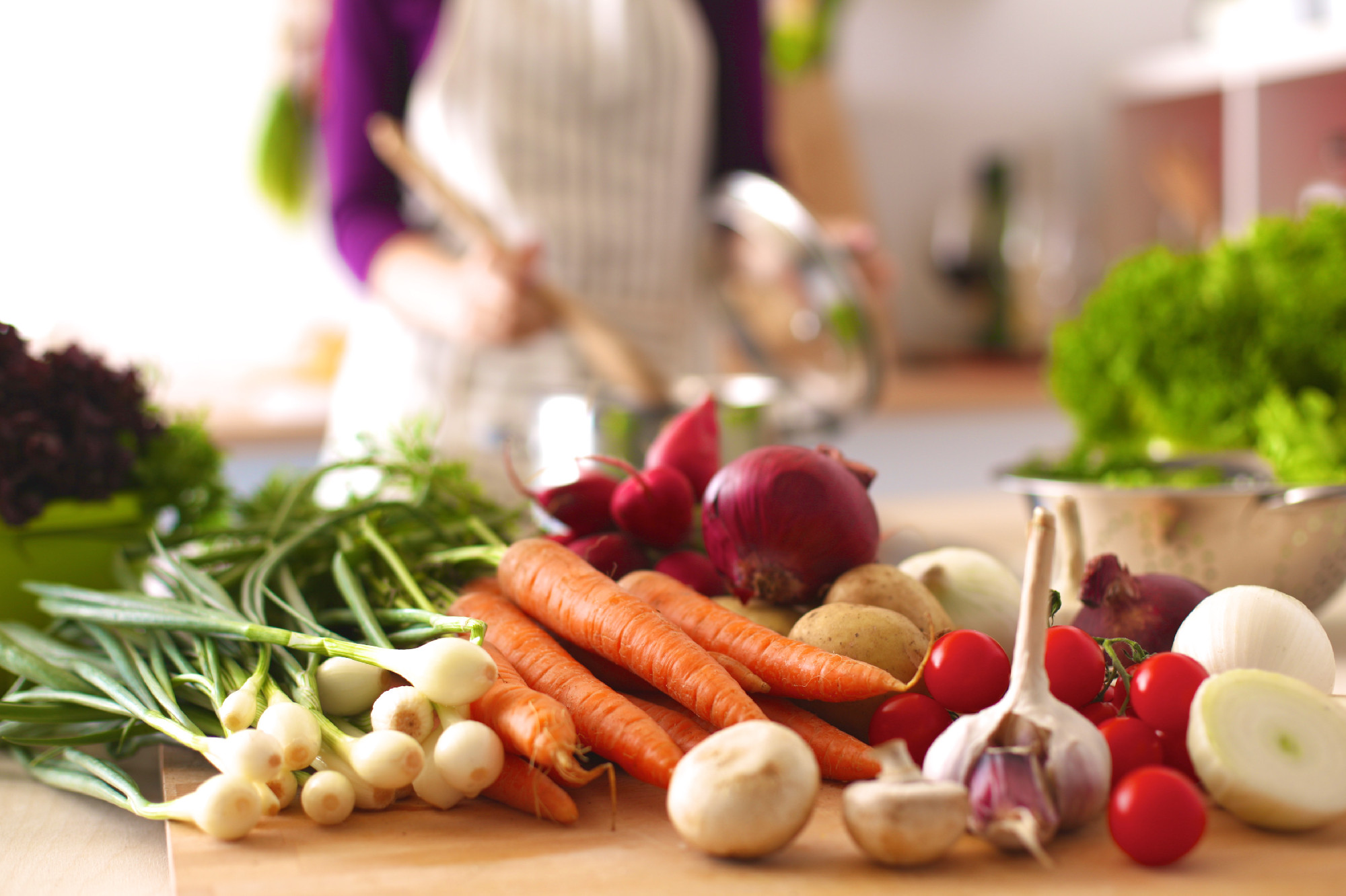 Young Woman Cooking in the kitchen. Healthy Food