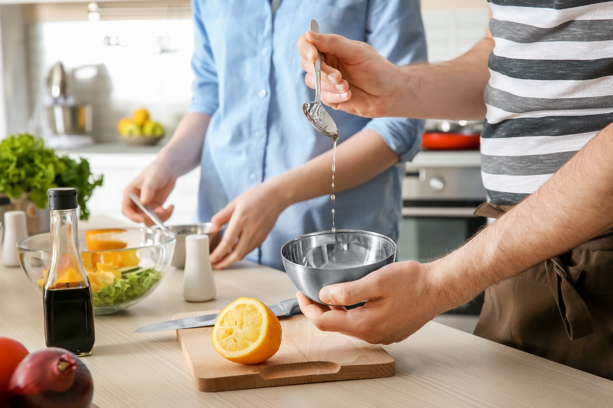 Chef giving cooking classes in kitchen�