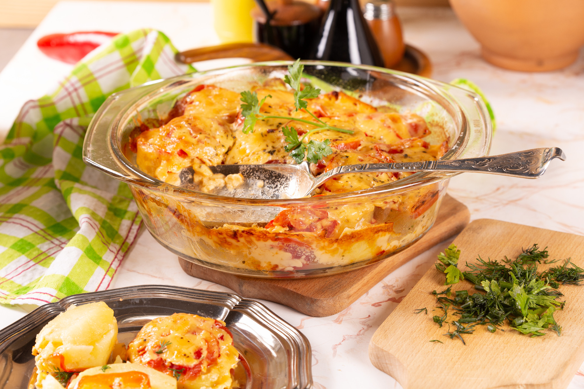 Potatoes baked with tomatoes and sweet peppers