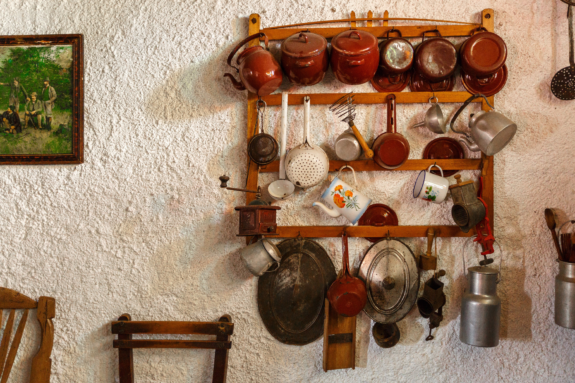 Pots, pans and utensils in an old village house kitchen