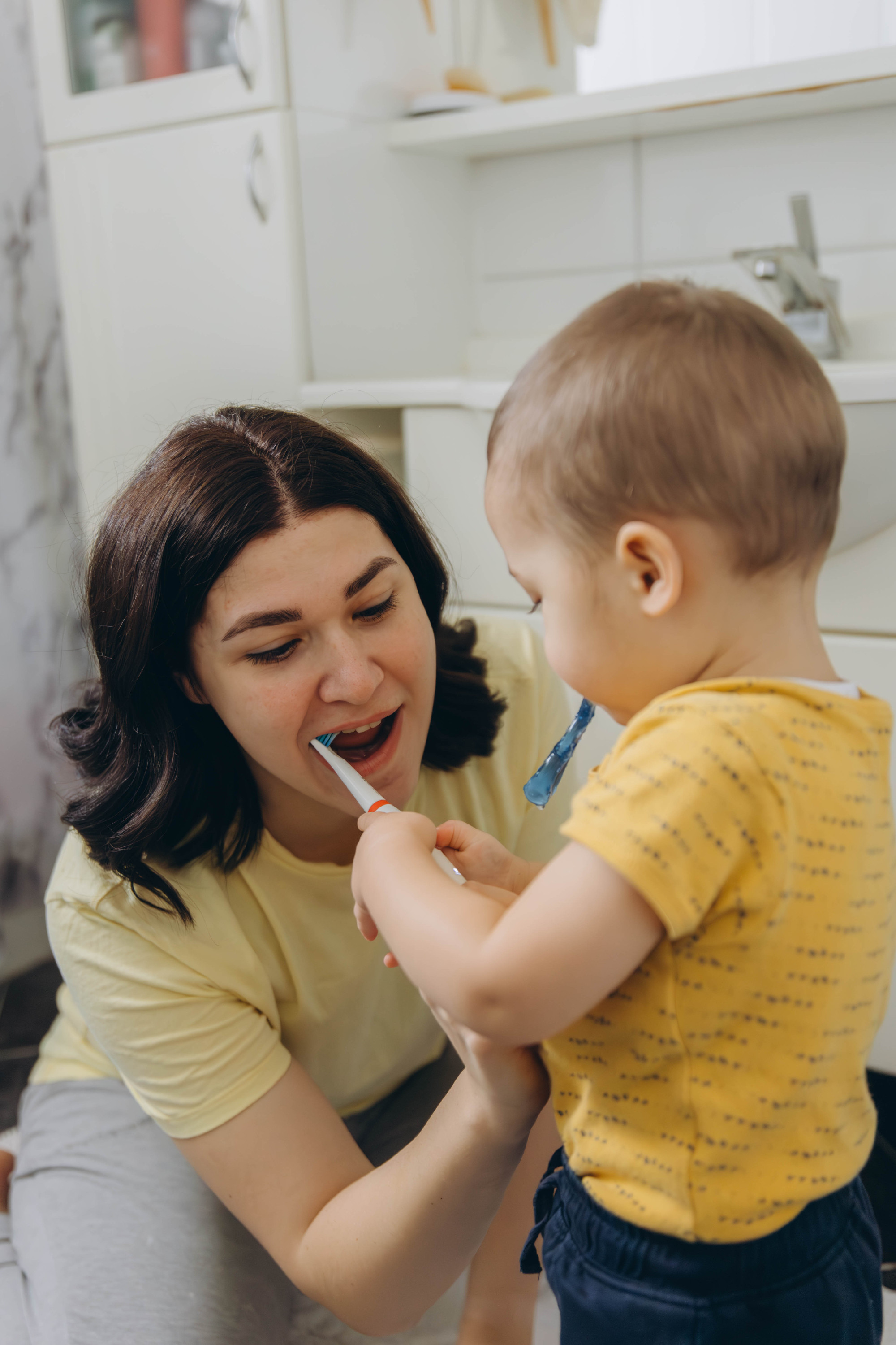 Dental care, mother brushing teeth with boy for wellness,Bathroom, oral health toothbrush