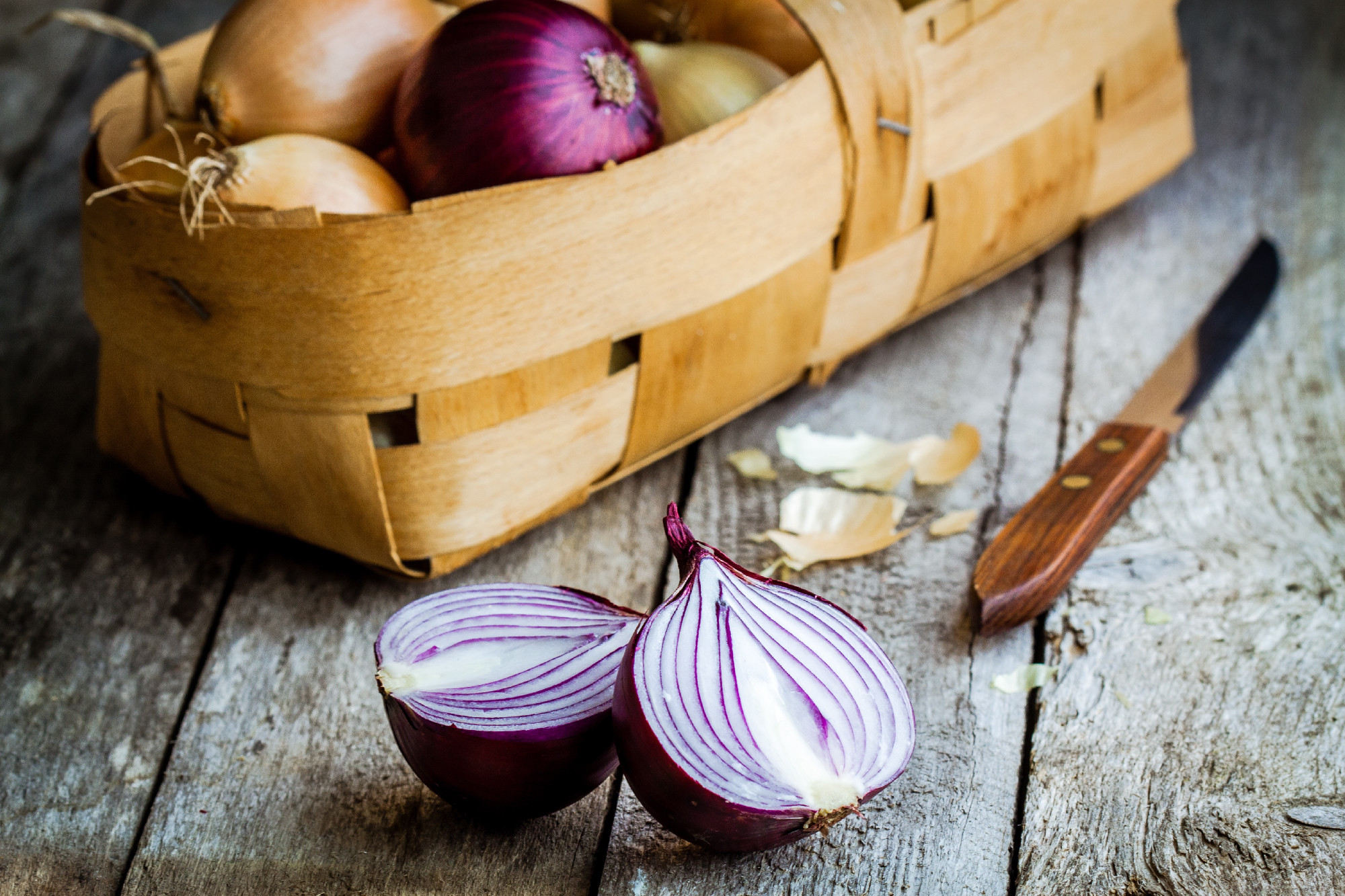 Fresh organic onions in a basket