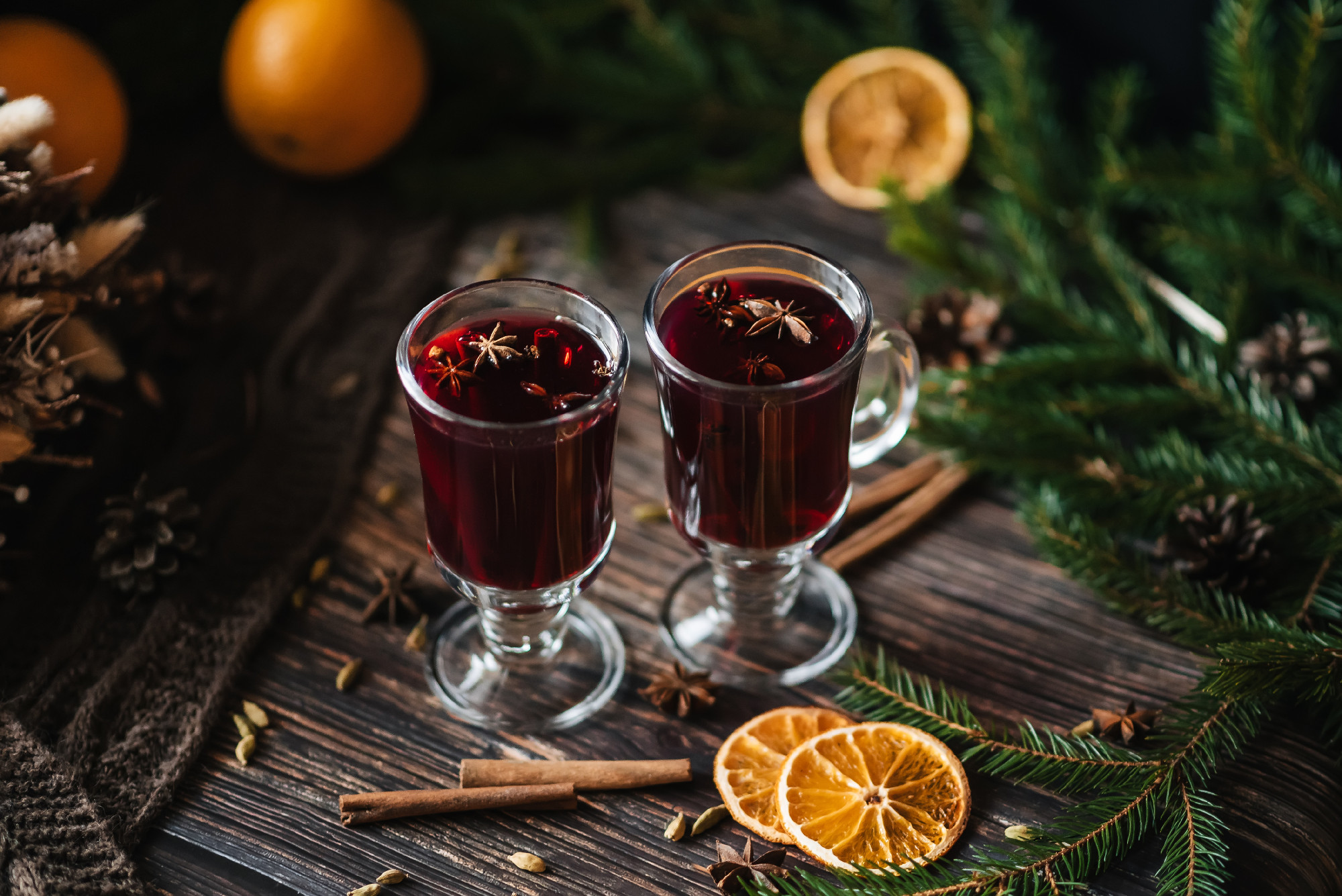 mulled wine in glasses with orange slices, cinnamon, cloves