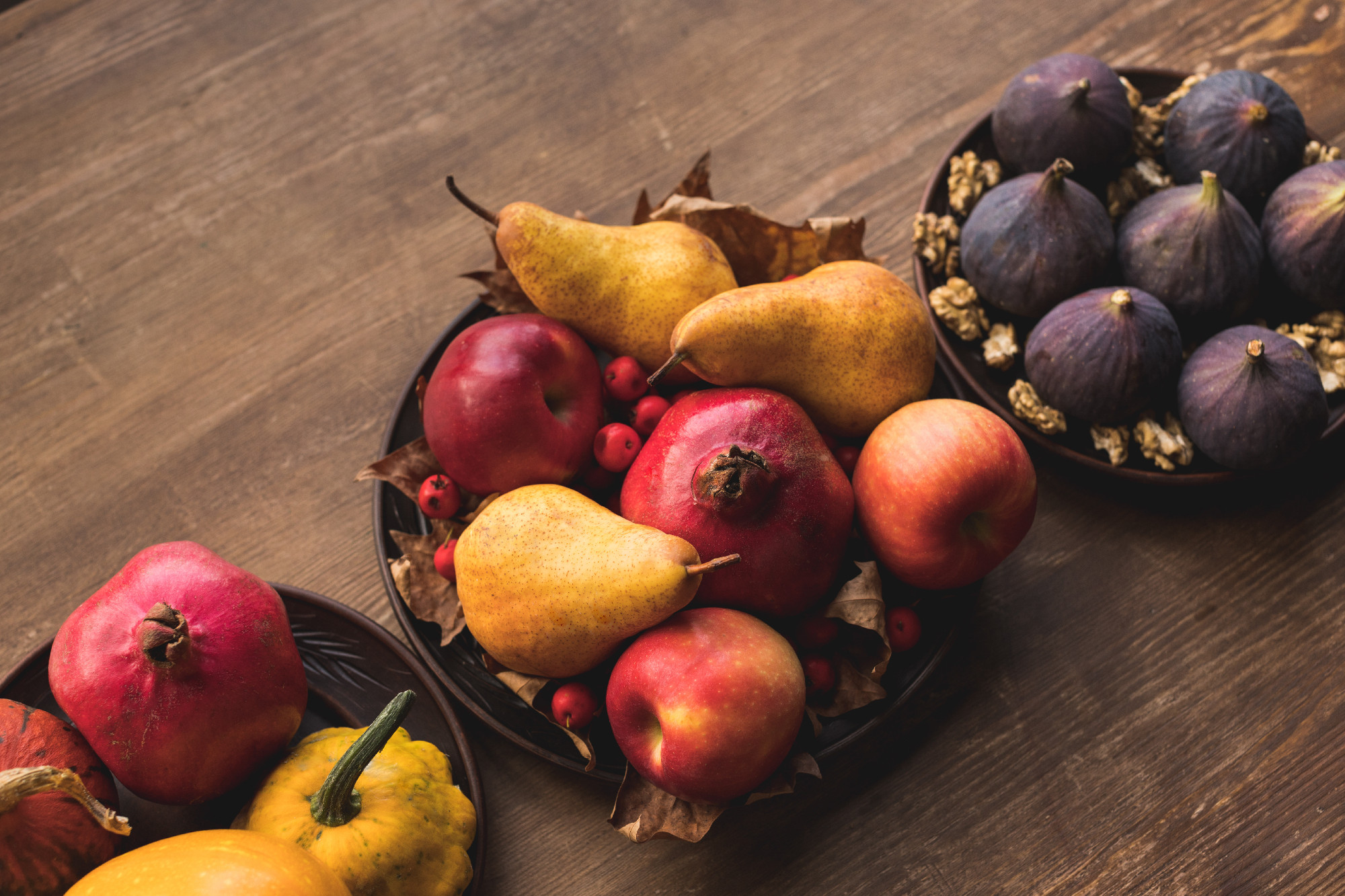 ripe autumn fruits on table