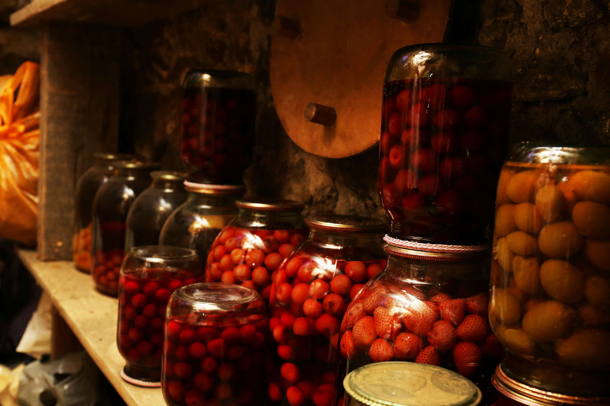 Home preservation in glass jars in cellar, closeup