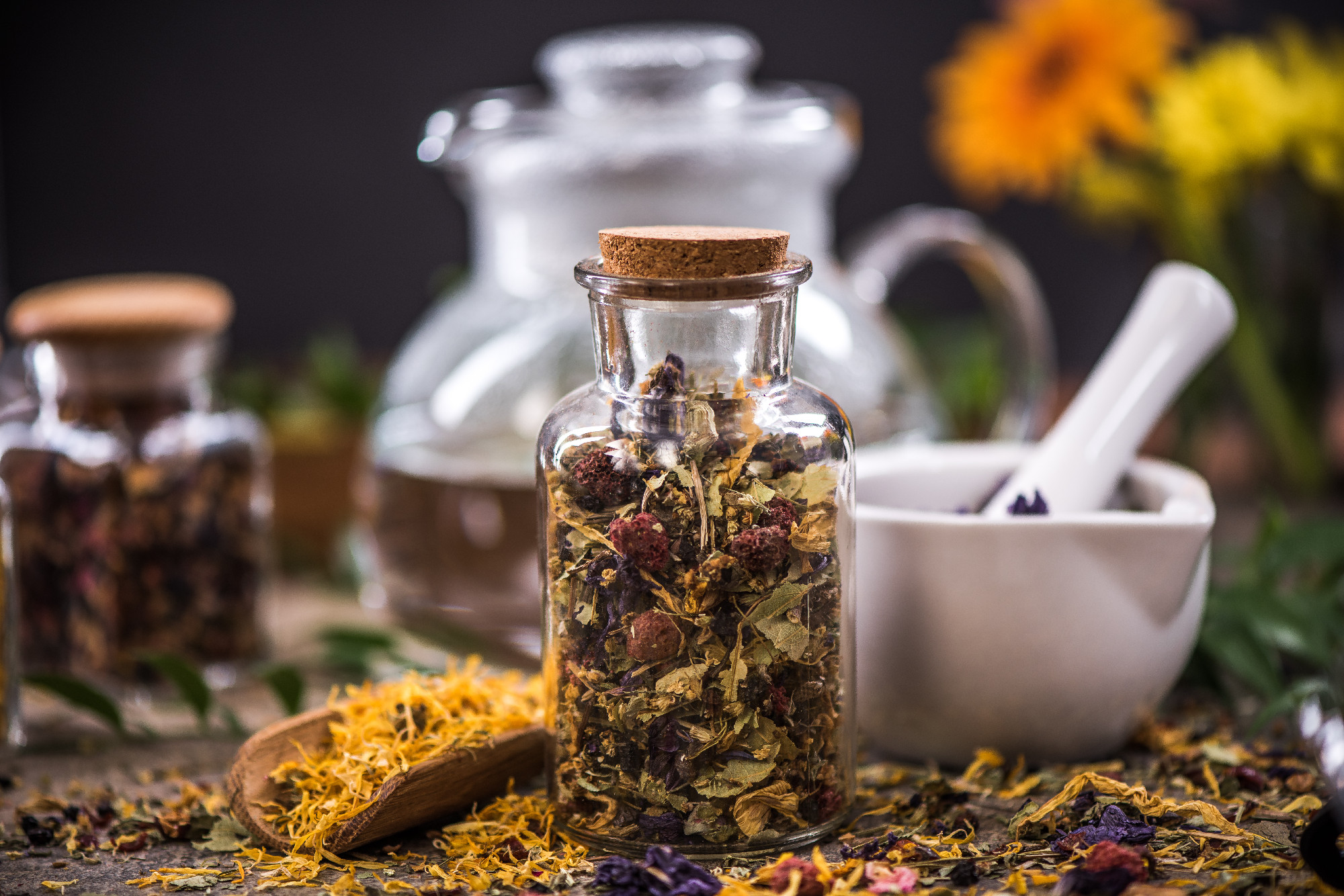 Tea with dried flowers and fruits in jar
