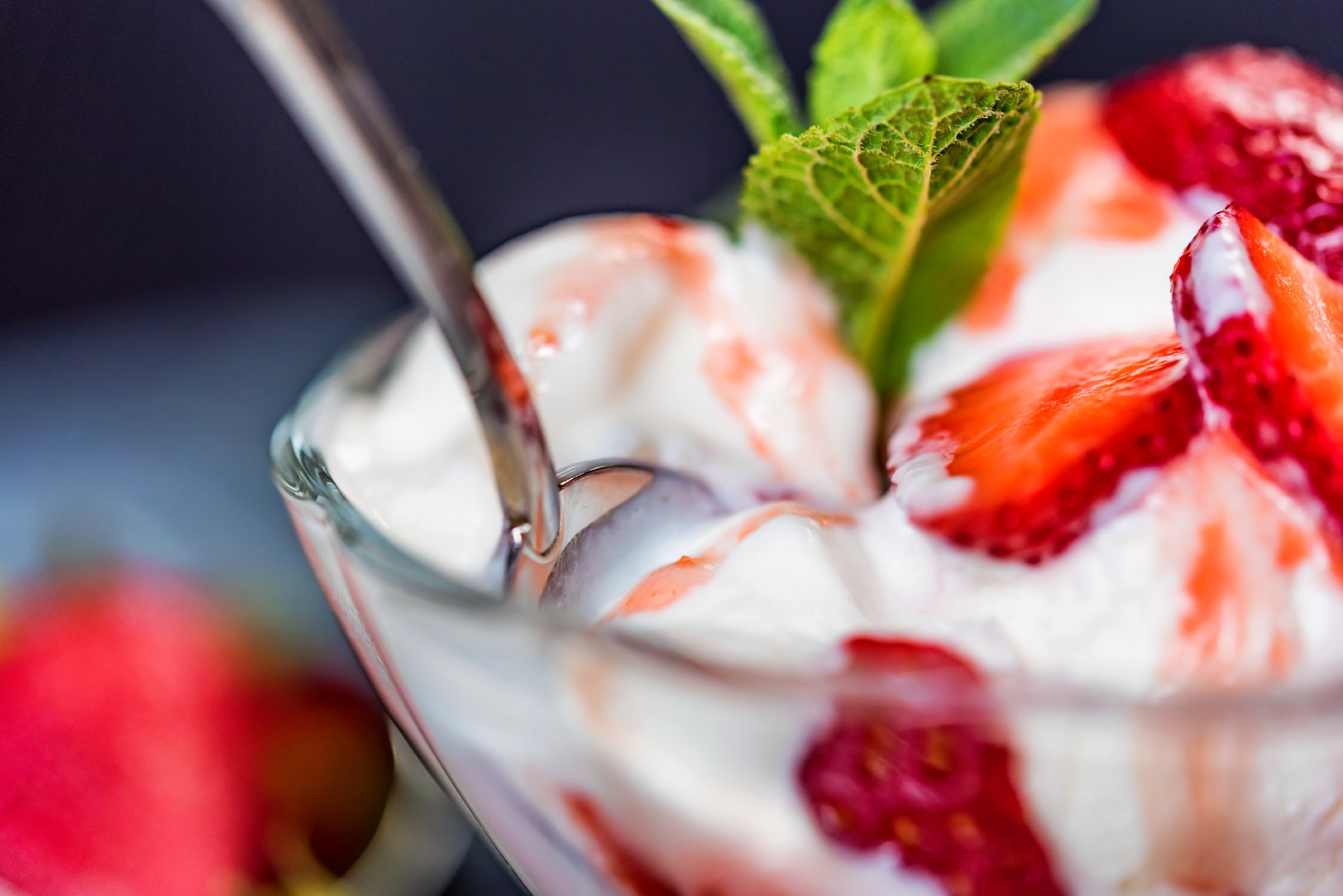 Strawberry ice cream with mint in bowl