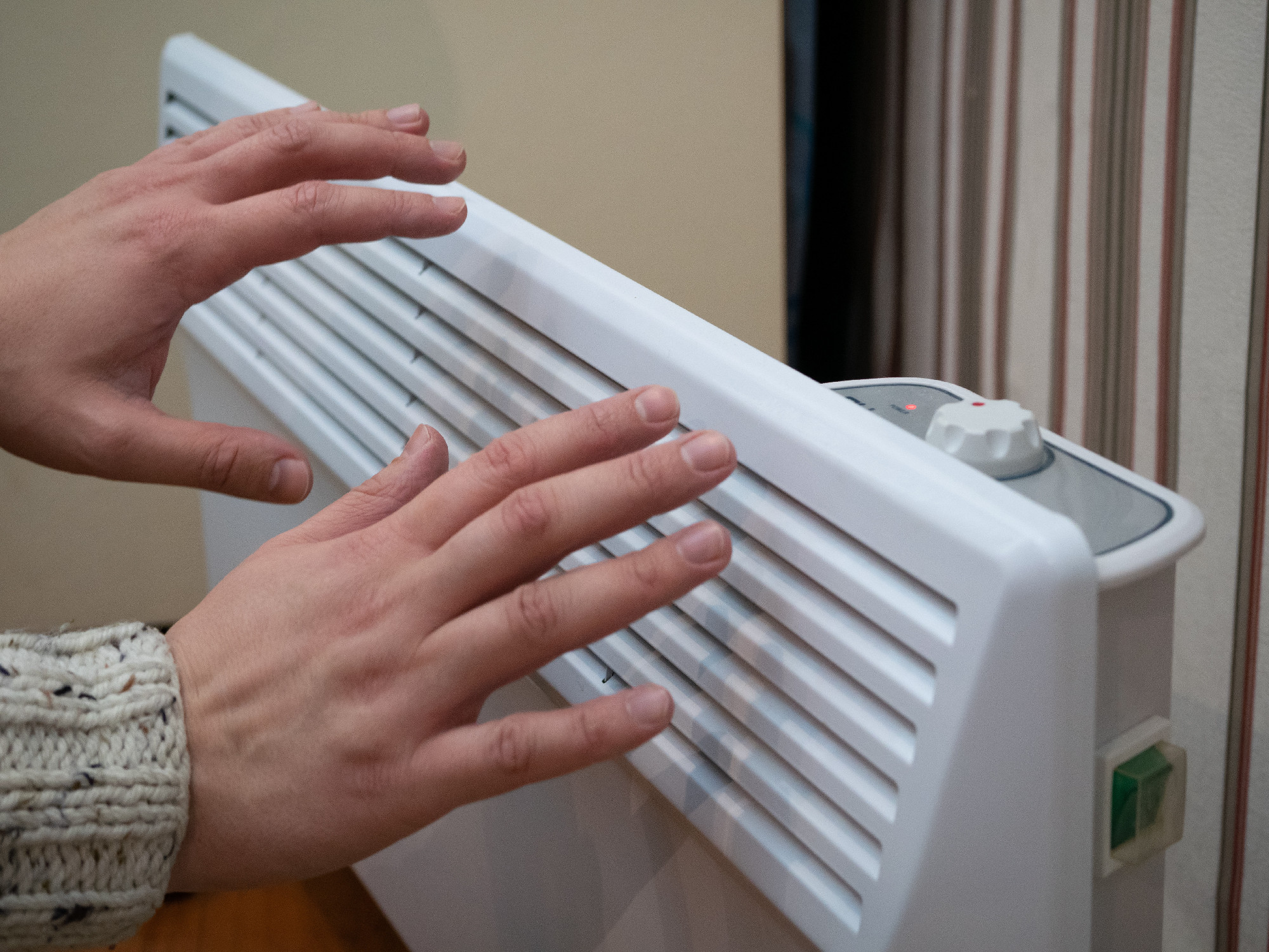 hands warm up at home electric heater