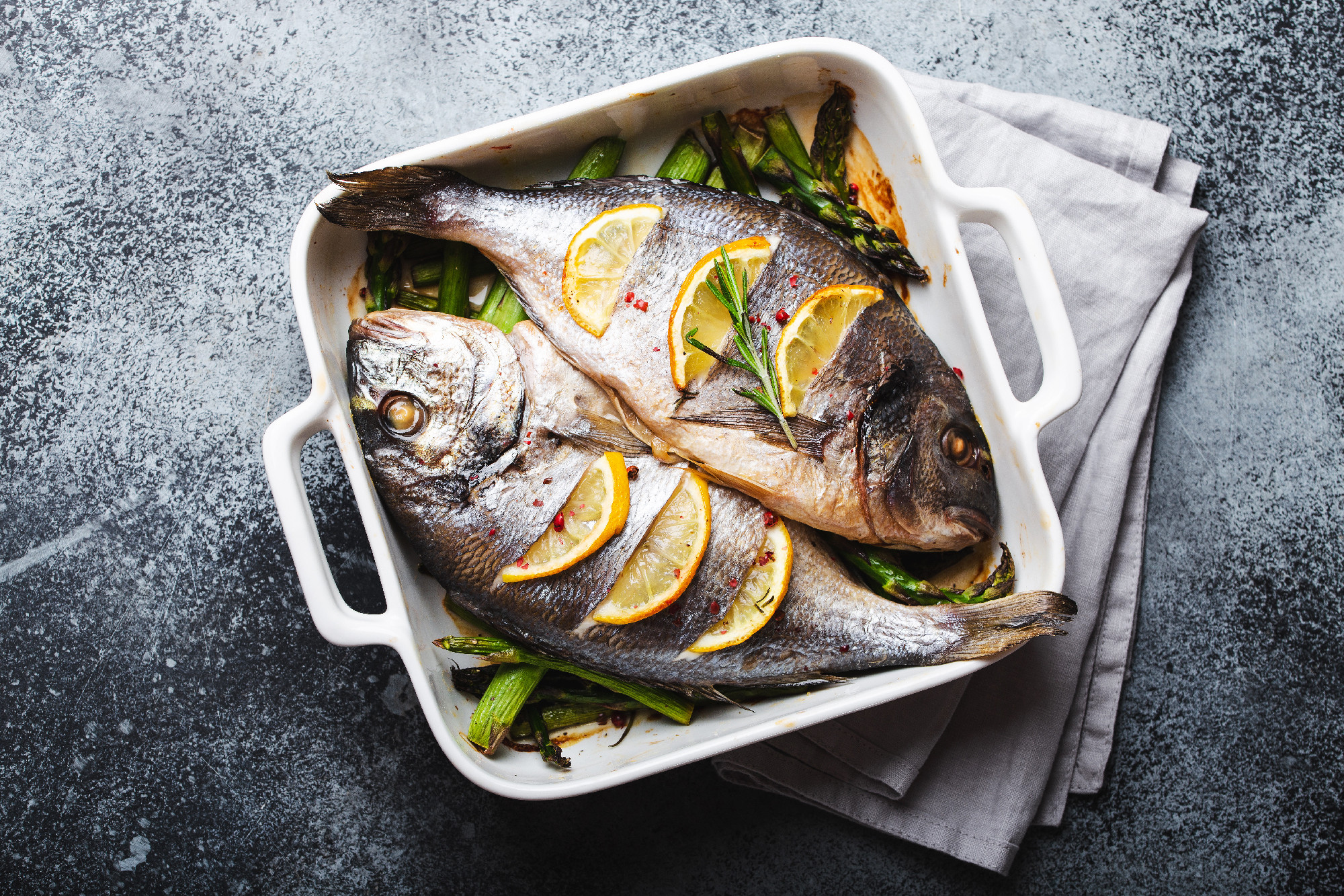 Fish dorado baked with asparagus