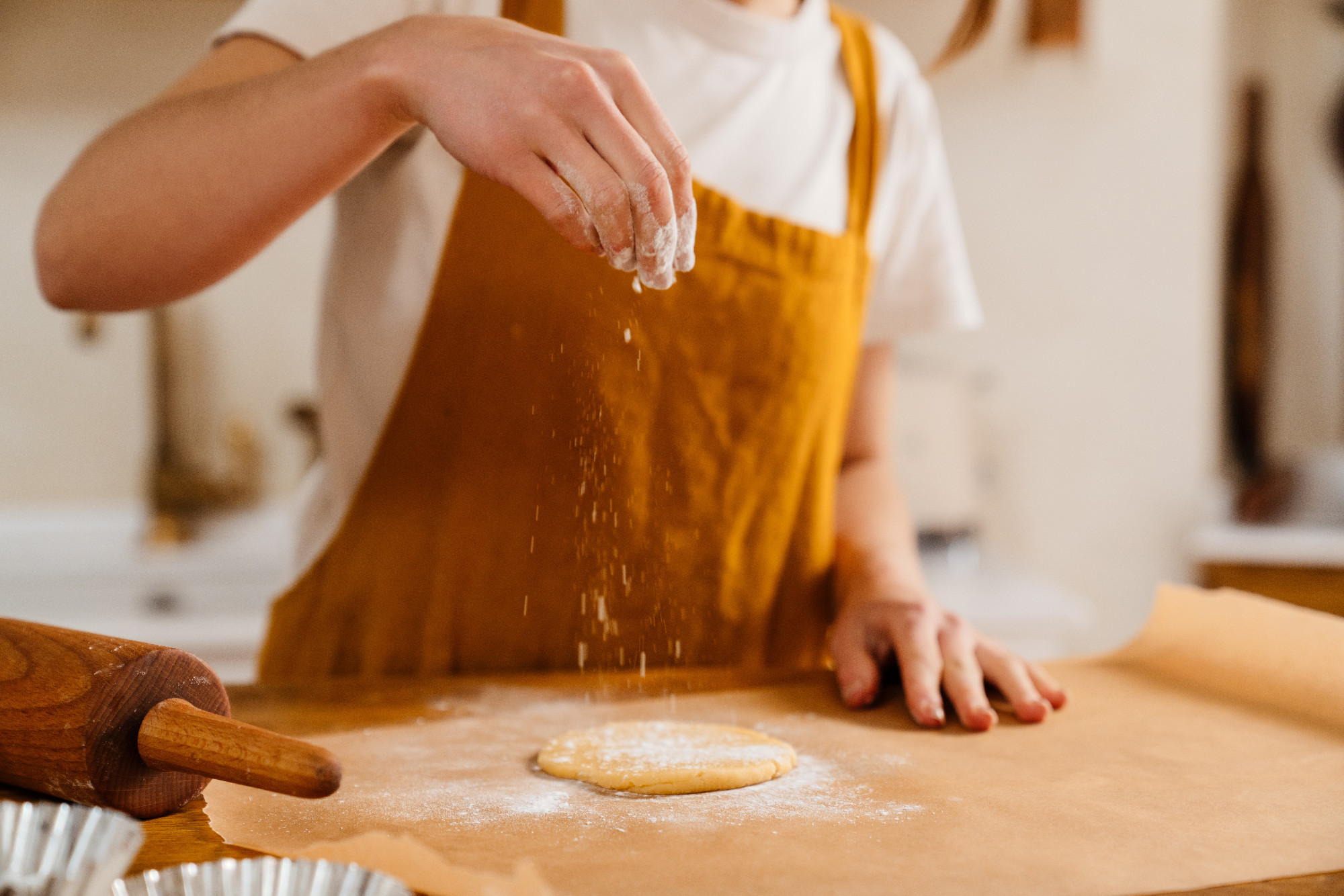 Caucasian pastry chef woman making cookies at cozy kitchen