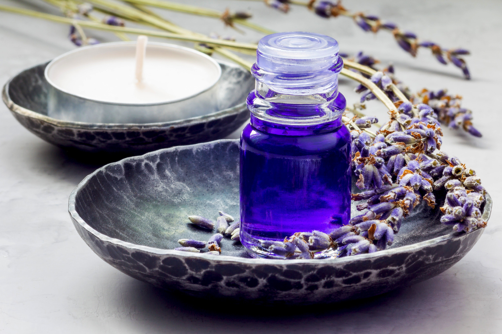 Lavender oil in a glass bottle. Horizontal close-up