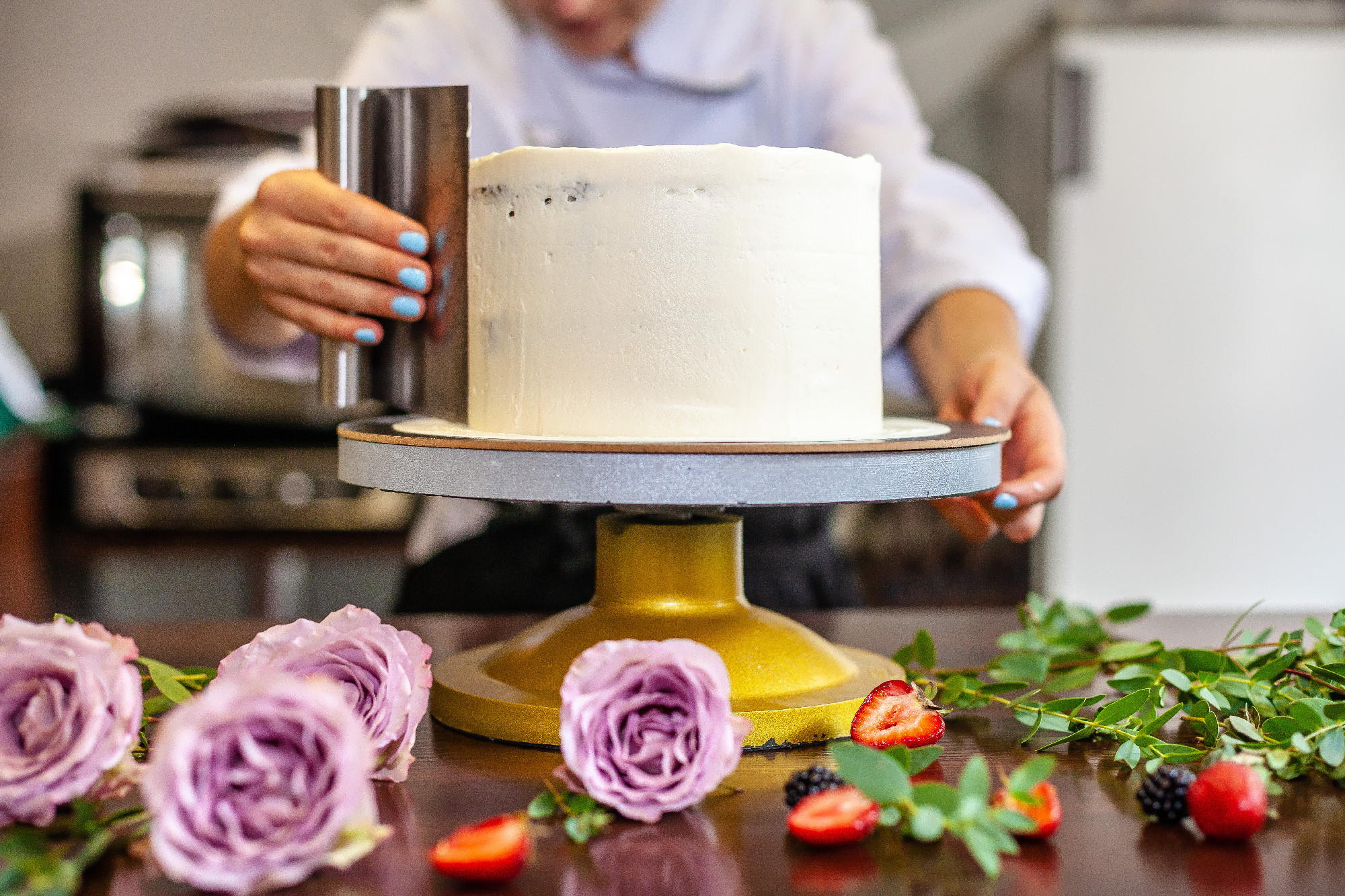 The chef's confectioner cooks a cake and decorates it with fresh flowers. background image.
