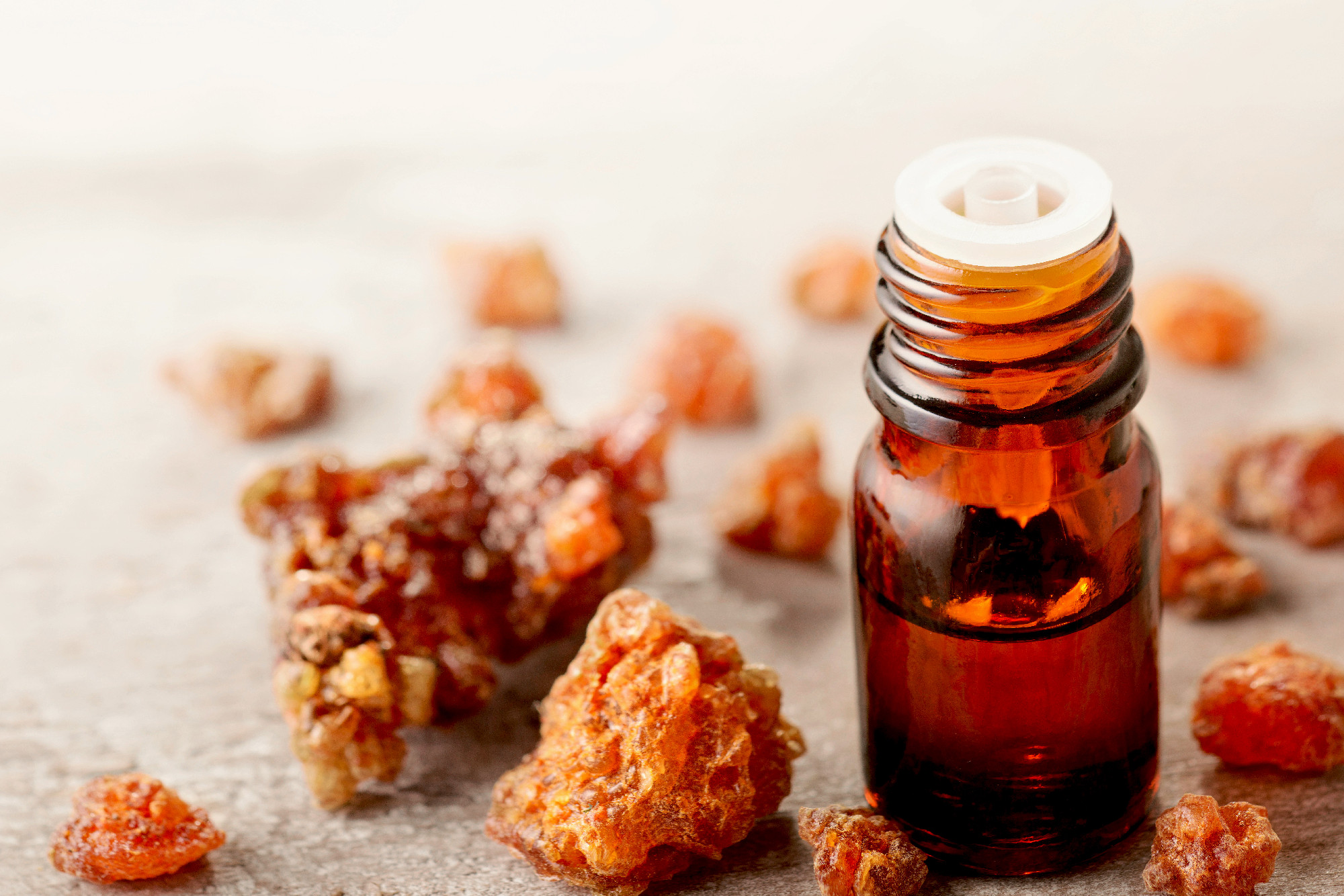 Myrrh essential oil on the wooden board