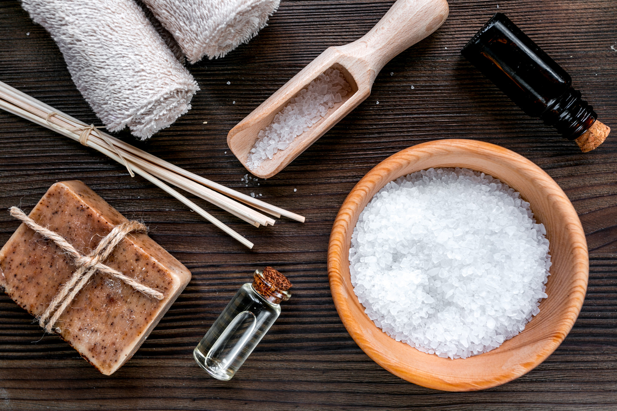 bathroom salt and natural soap for spa on wooden background top