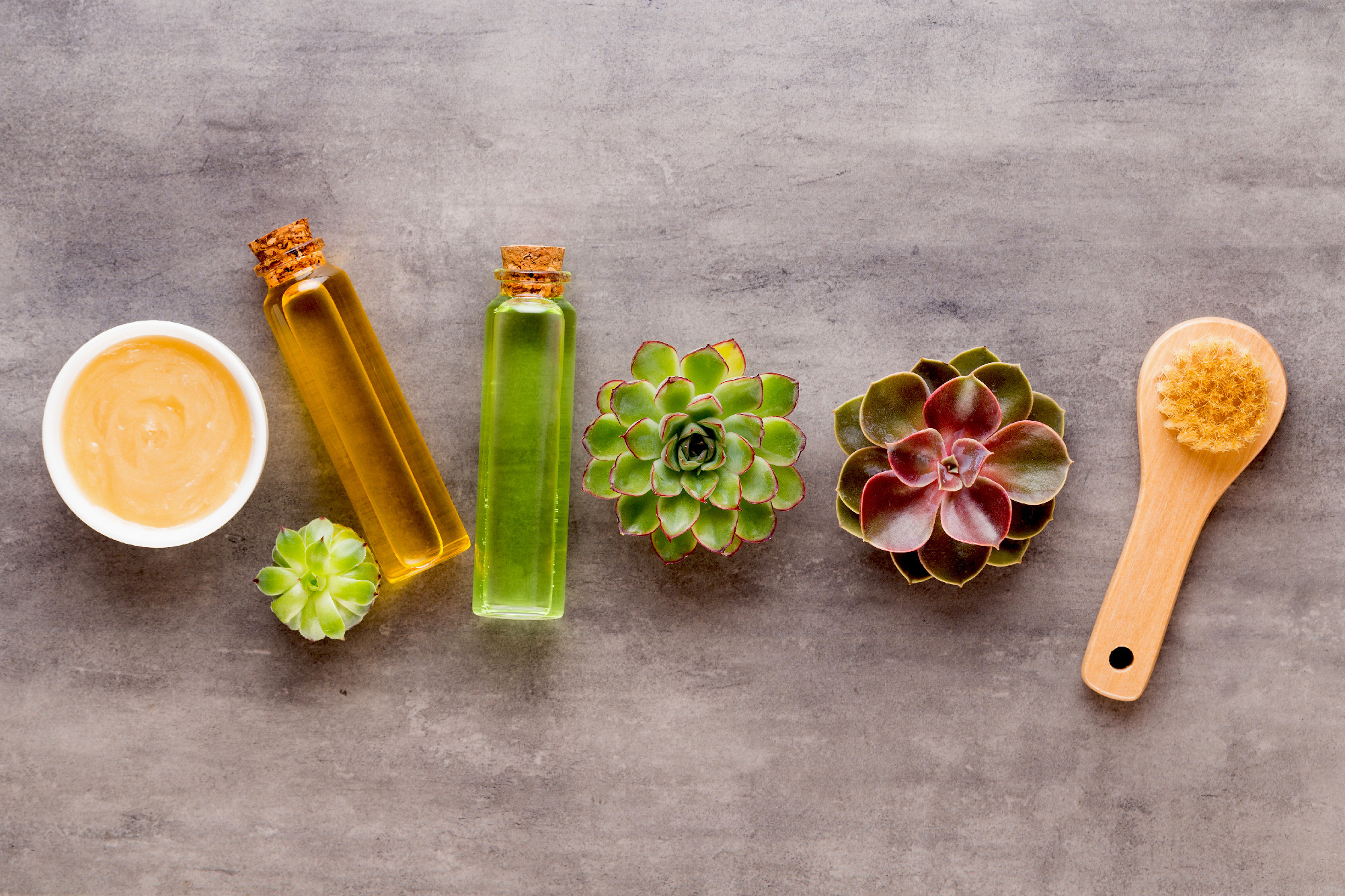 Spa background with hand made bio cosmetic and cactus compositi