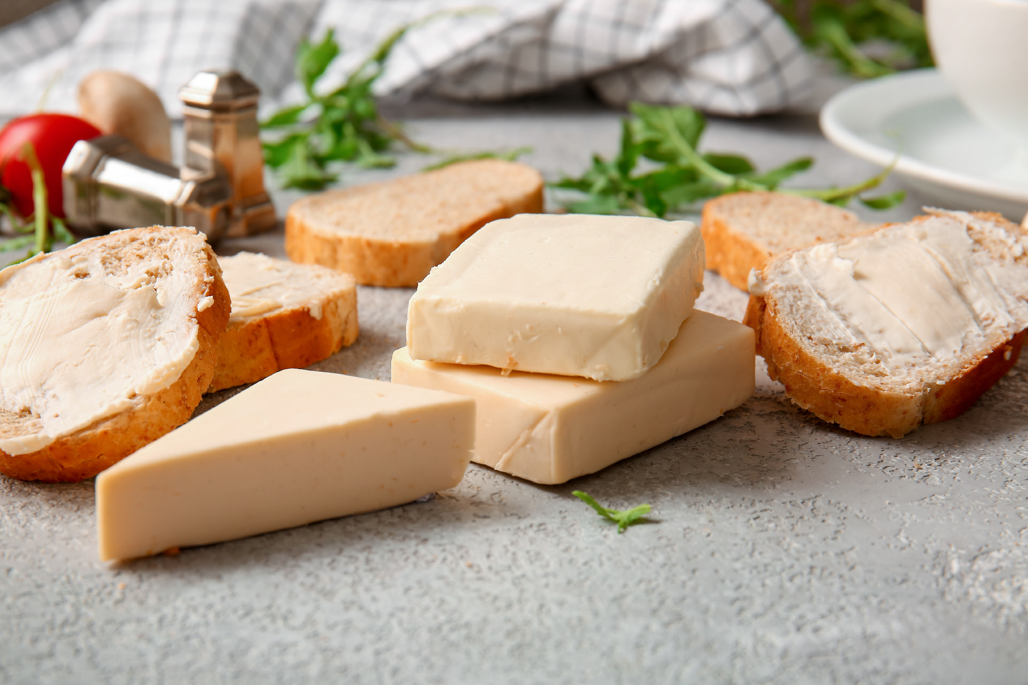 Sandwiches with processed cheese and herbs on grunge background�