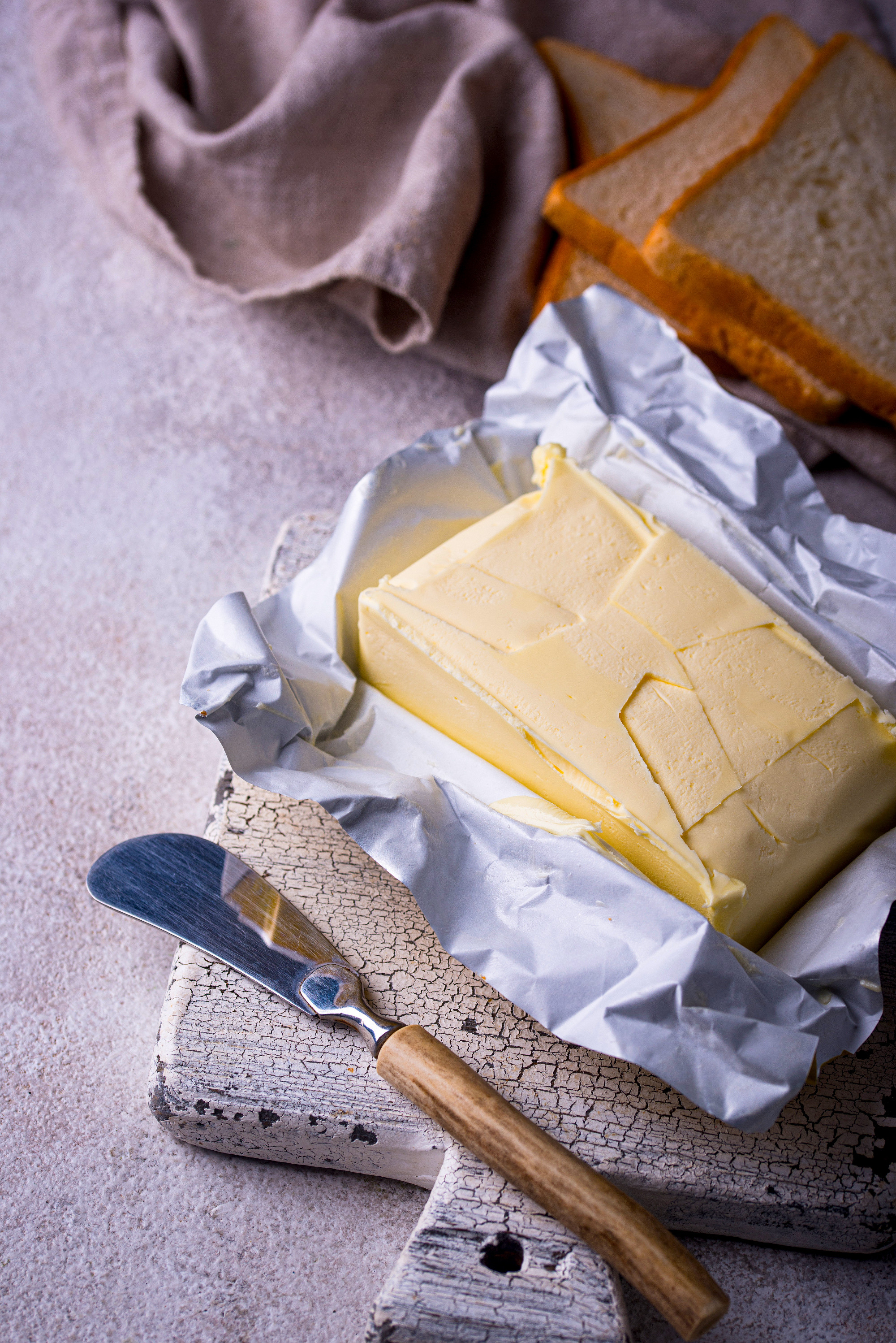 Fresh butter on grey backgrouns.