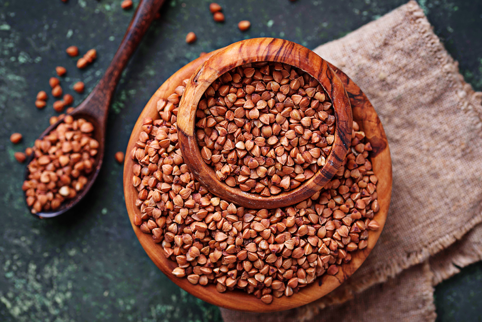 Buckwheat groats in wooden bowl