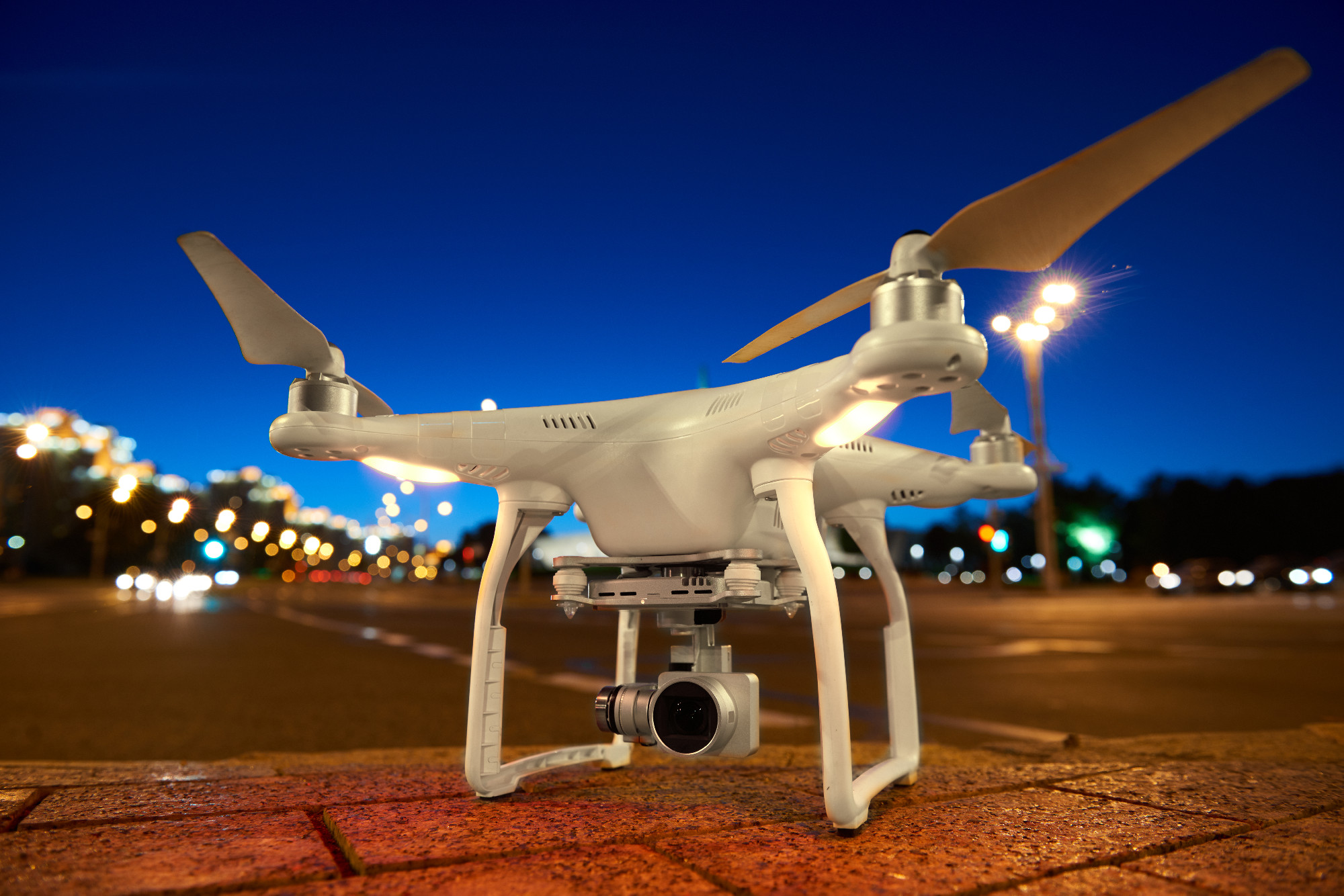 Drone ready to fly standing on urban street