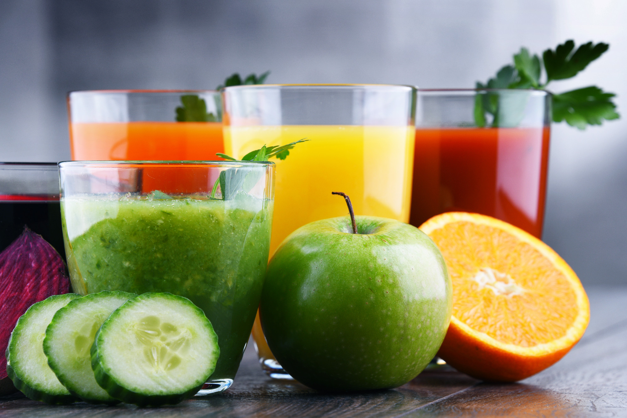 Glasses with fresh organic vegetable and fruit juices