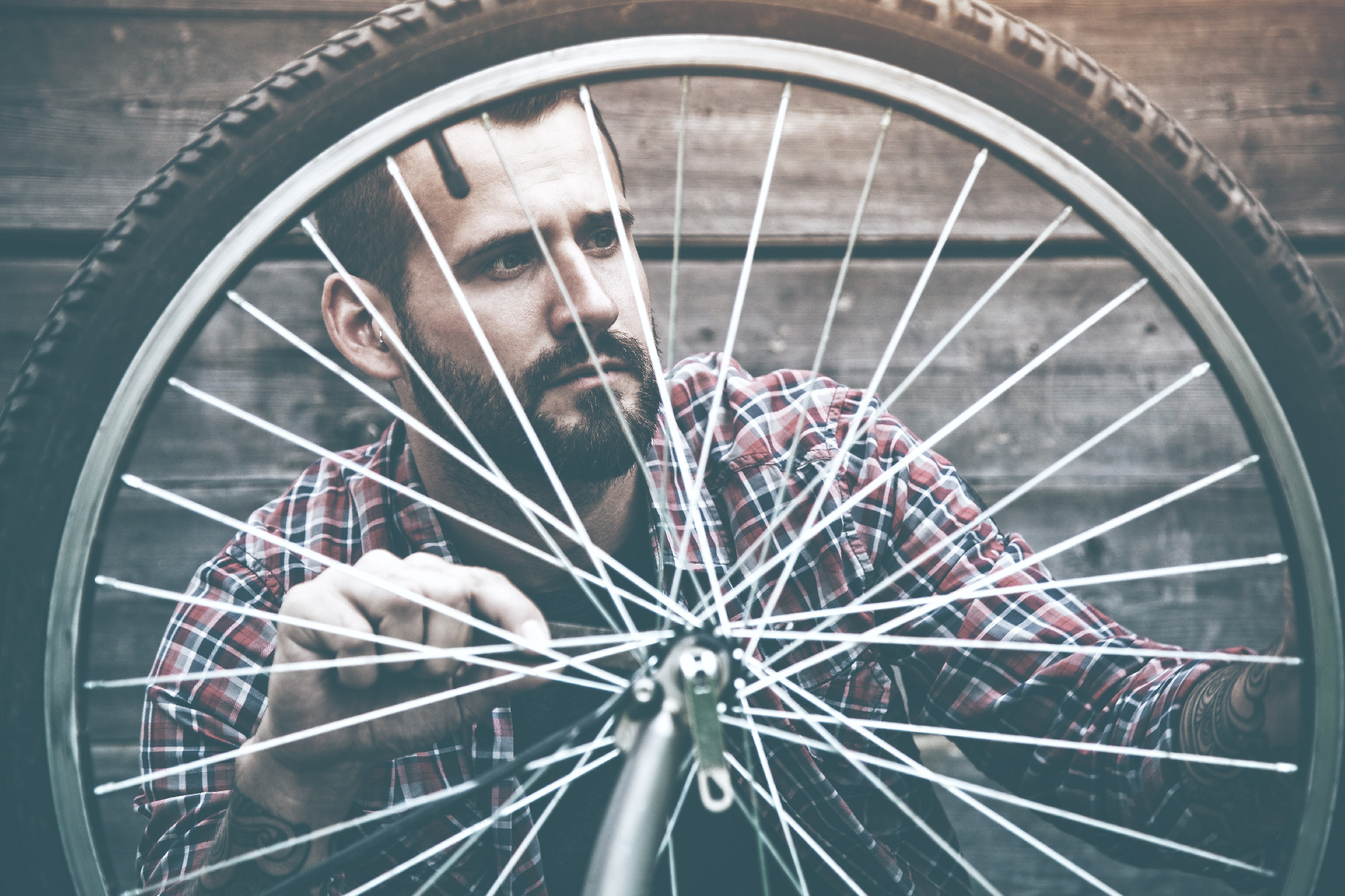 man repairing bike
