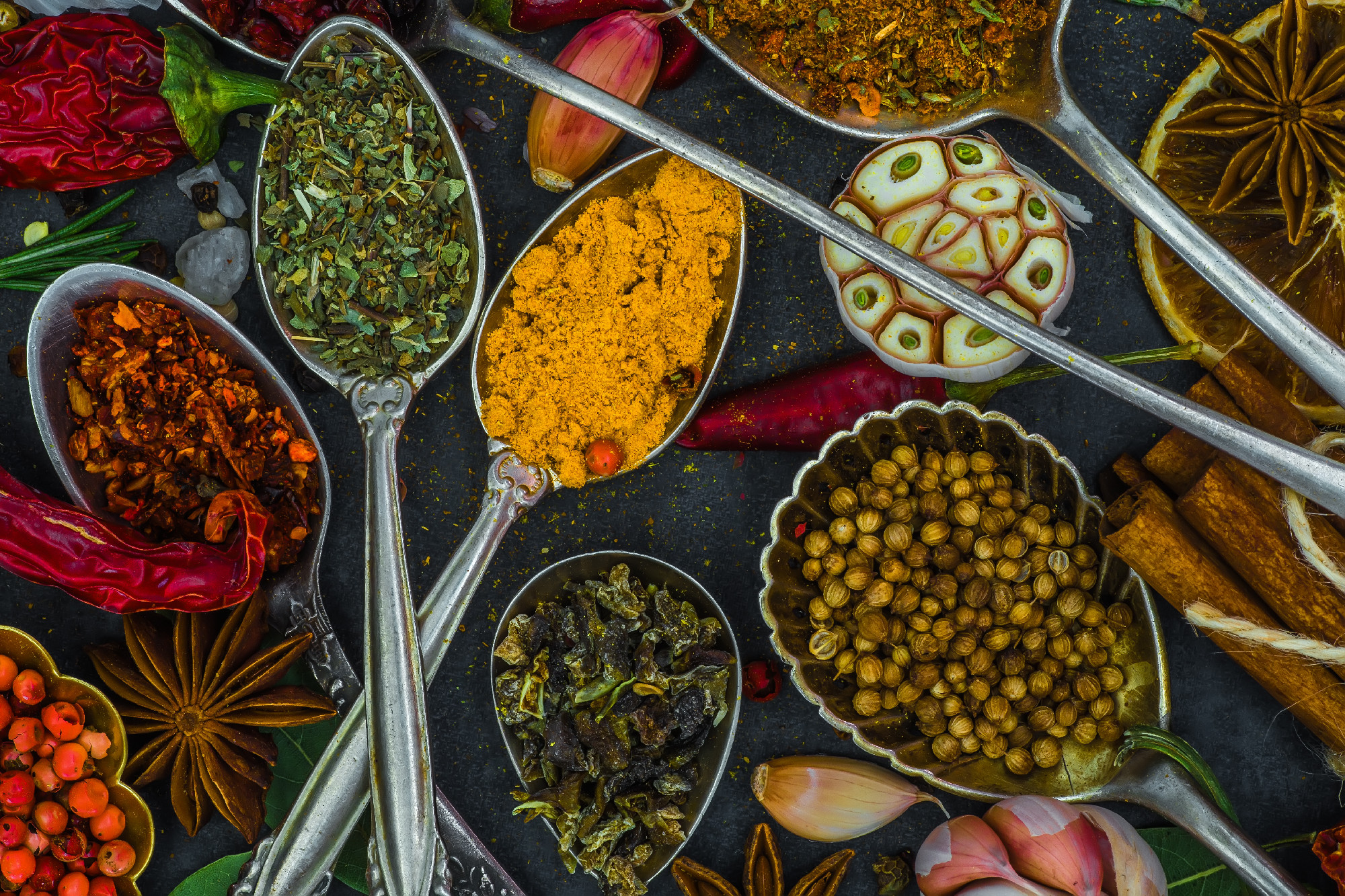 Spices and herbs in metal bowls. Food and cuisine ingredients. C