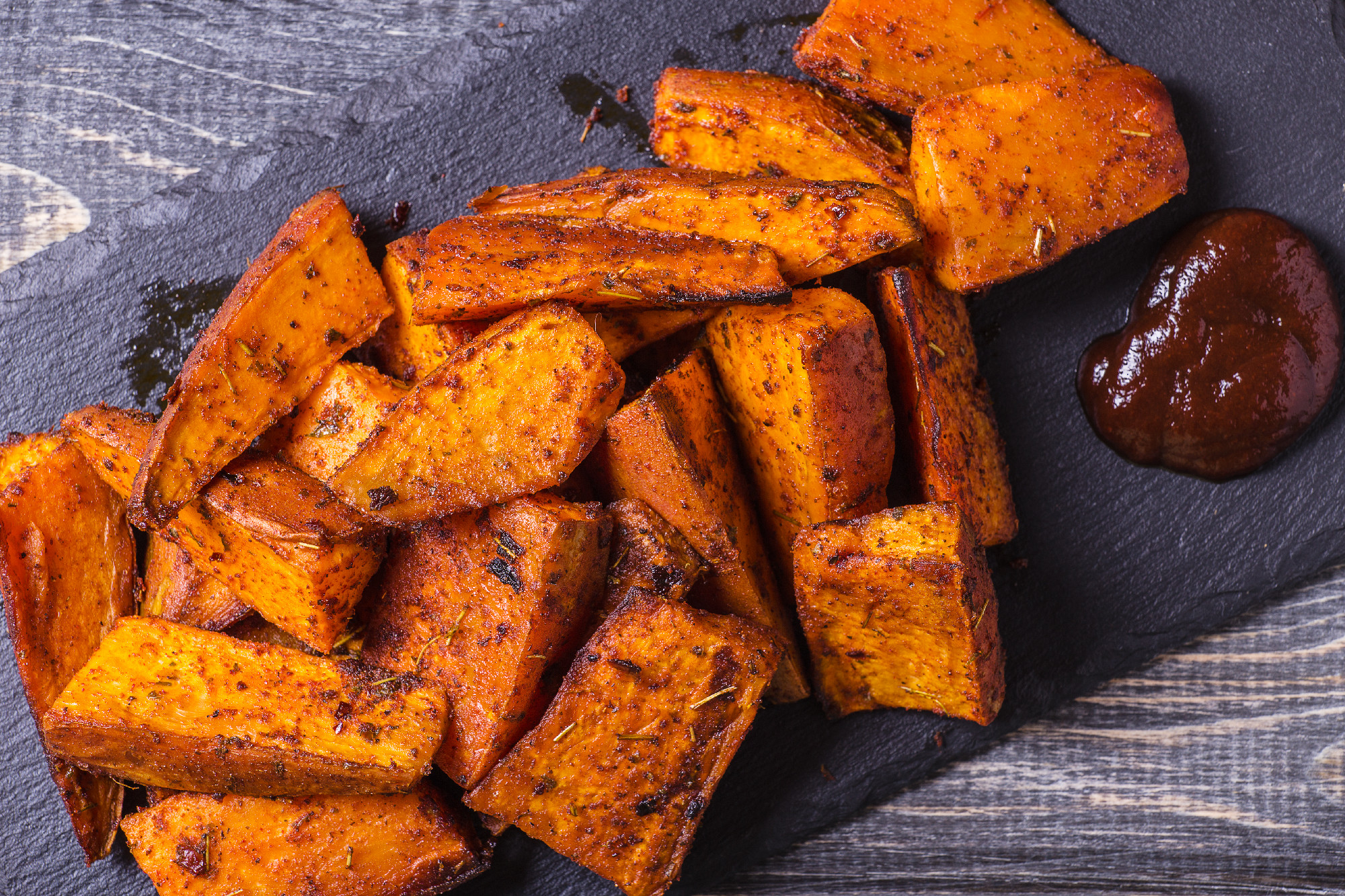 Homemade Cooked Sweet Potato with spices and herbs.
