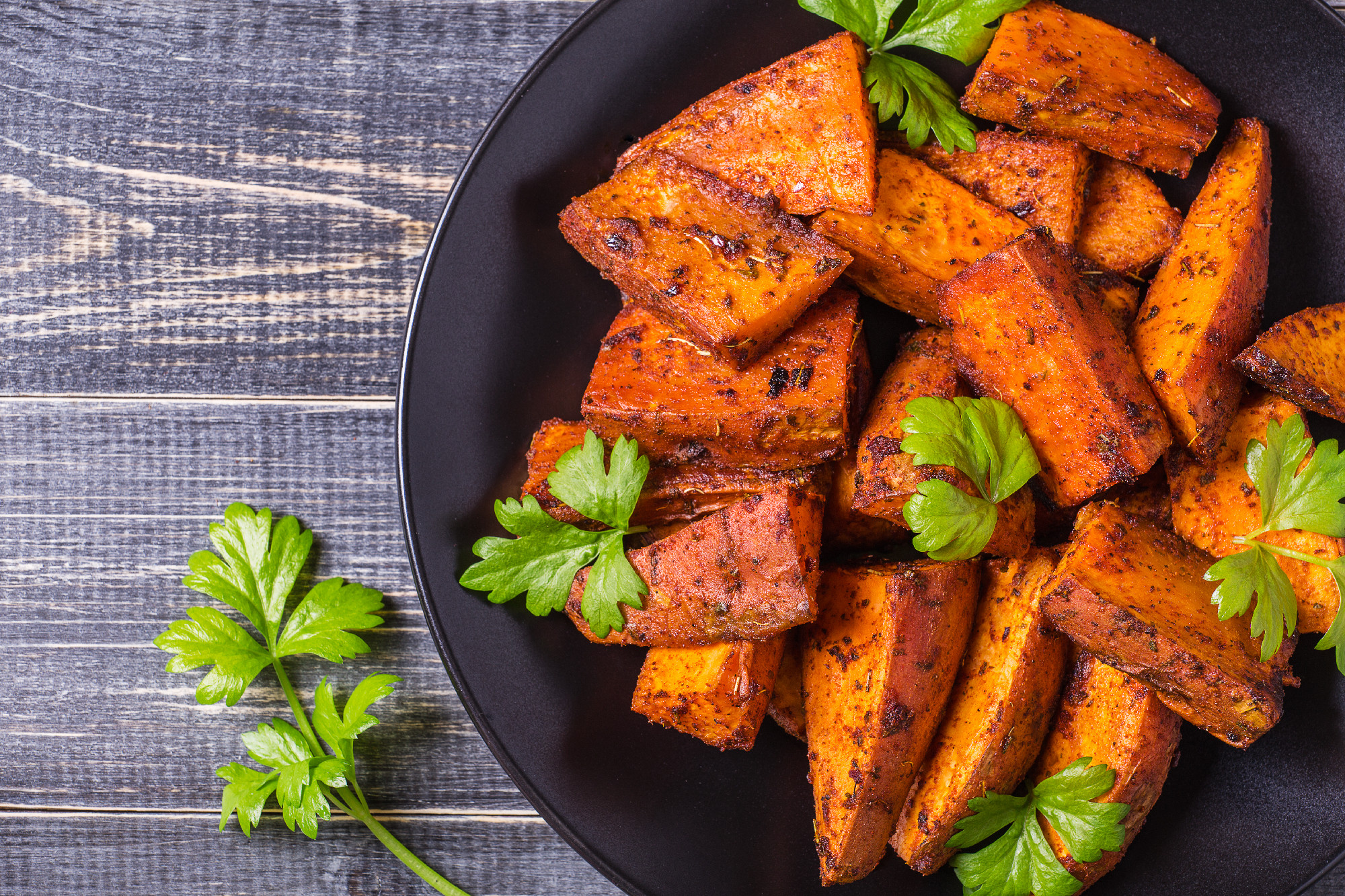Homemade Cooked Sweet Potato with spices and herbs.