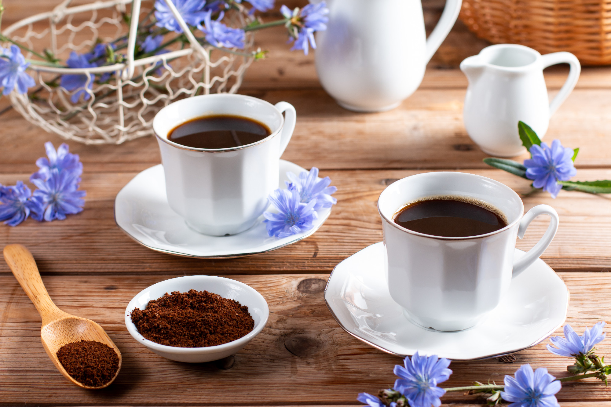 Healing drinks. Chicory drink. Cup of chicory drink and flowers on a table