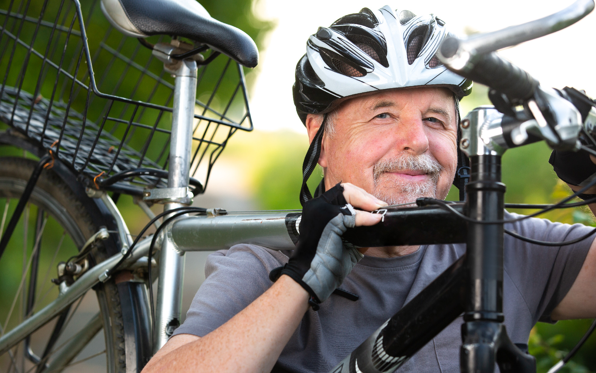 Portrait of active senior man with his bike in outside, healthy lifestyle sport concept