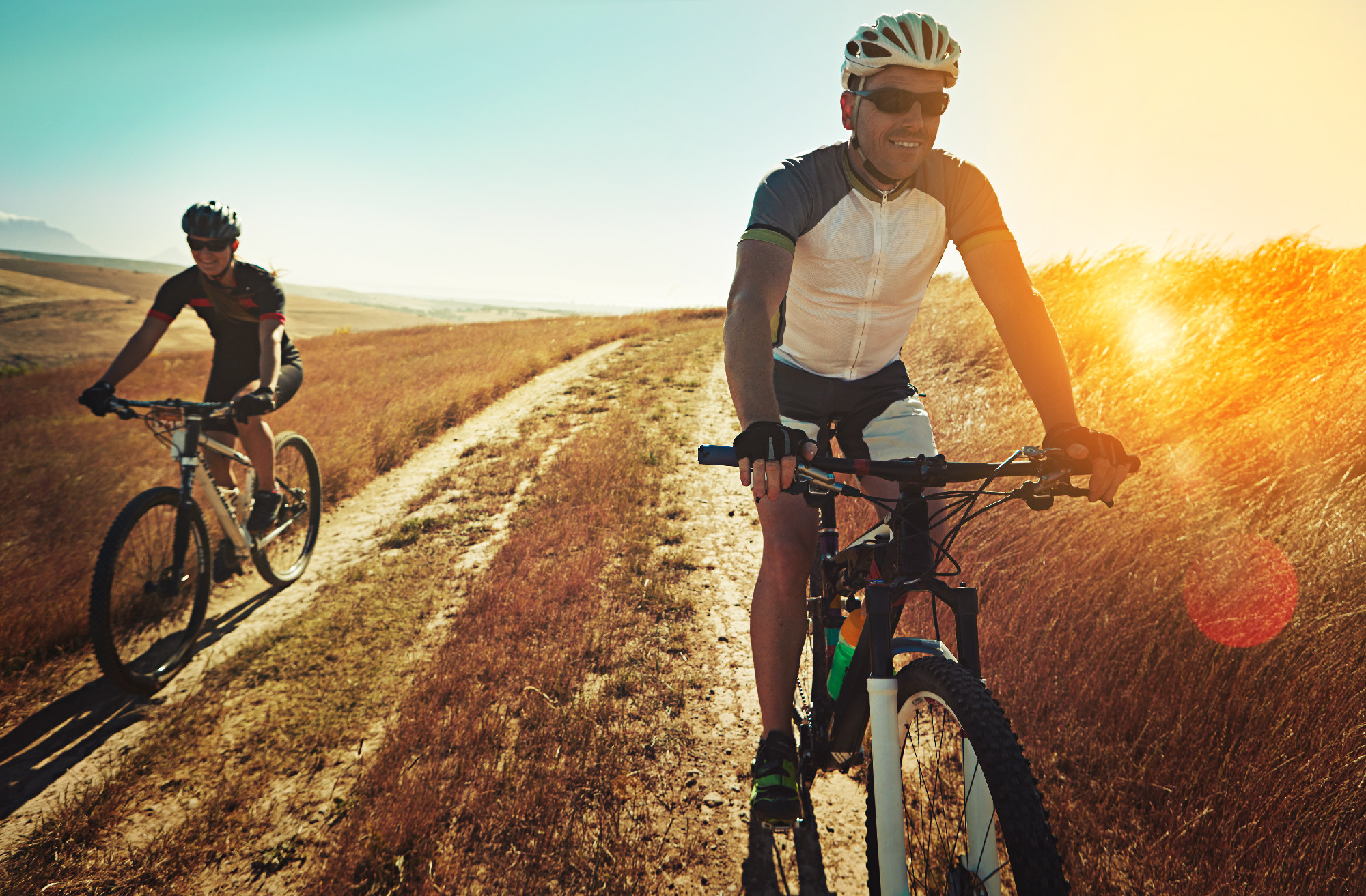 Cars kill, bikes thrill. two cyclists out cycling in the countryside.