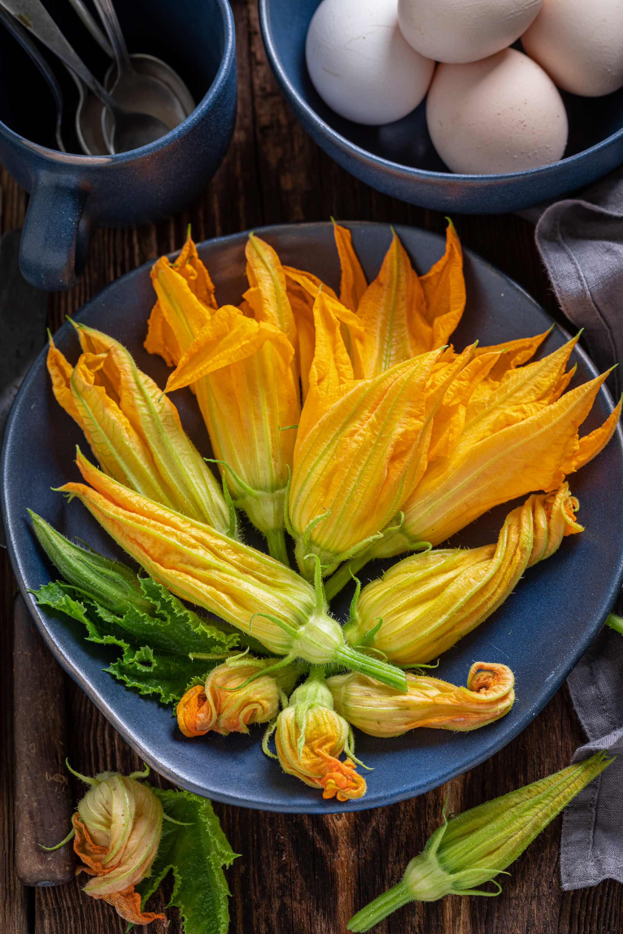 Preparation for fried zucchini flower as seasonal snack.