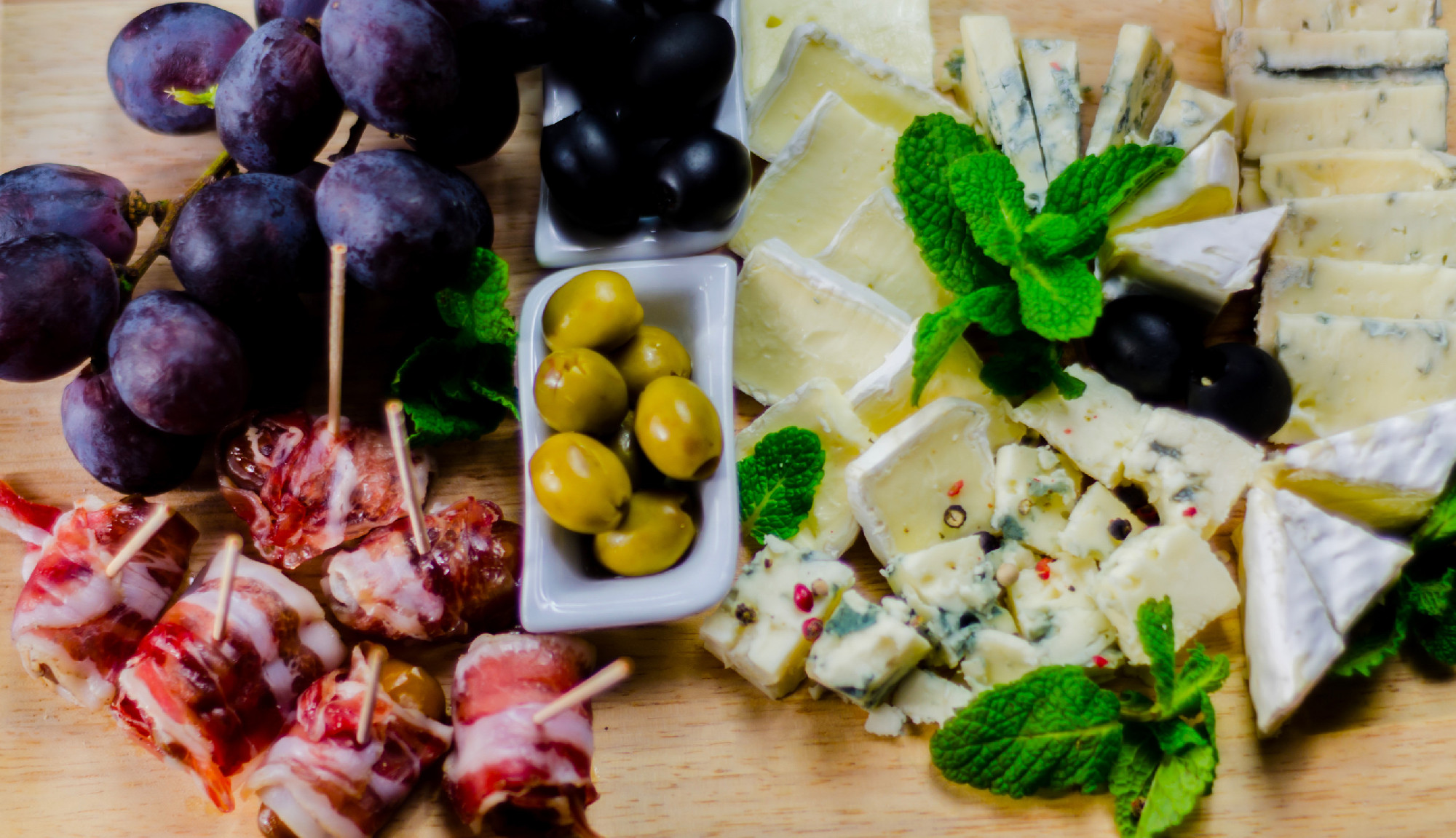 set of different cheeses on a wooden board, cheese board, delici
