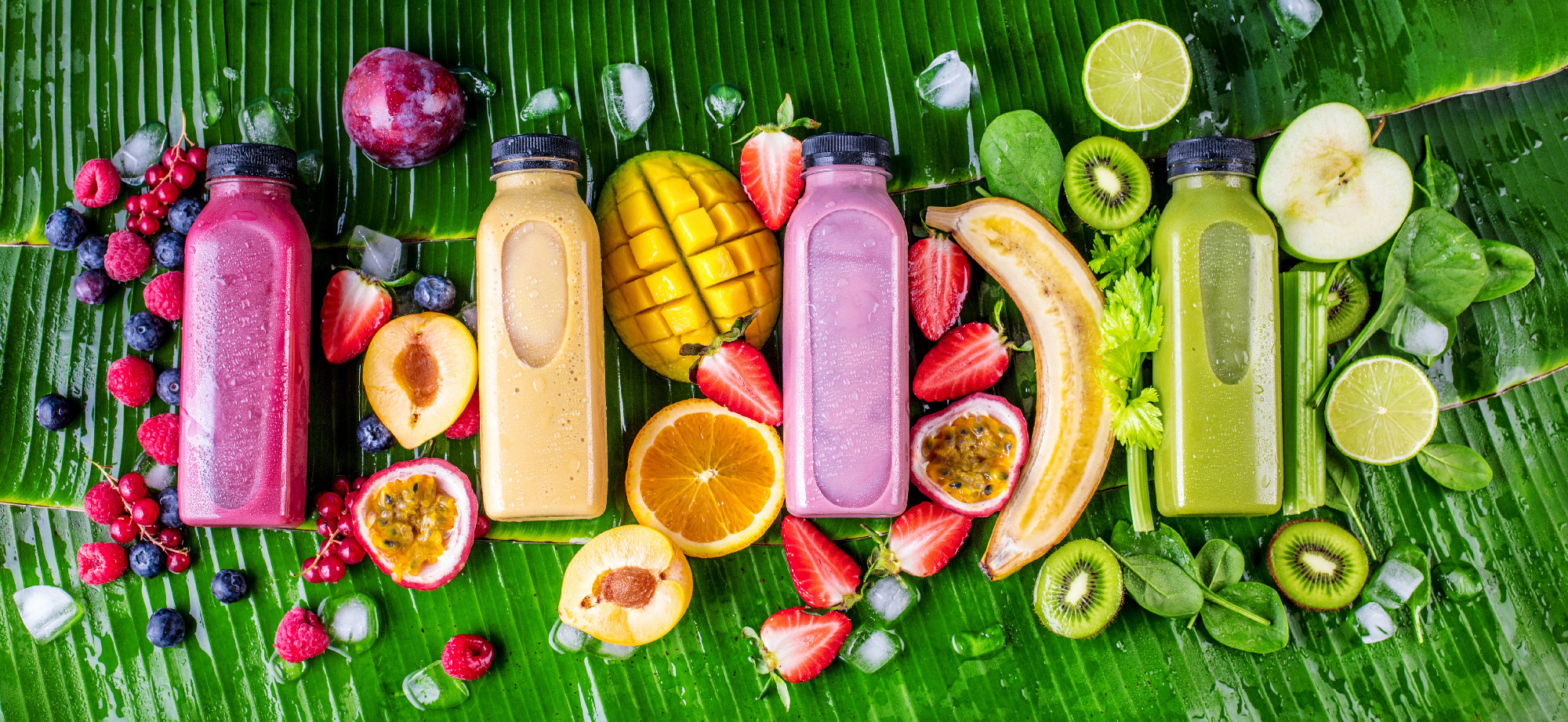 Healthy smoothies with fresh ingredients on a tropical Backgroun