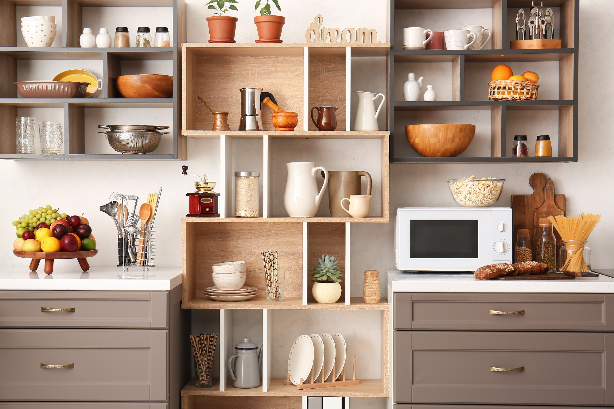 Interior of modern kitchen with counters, shelves and utensils�