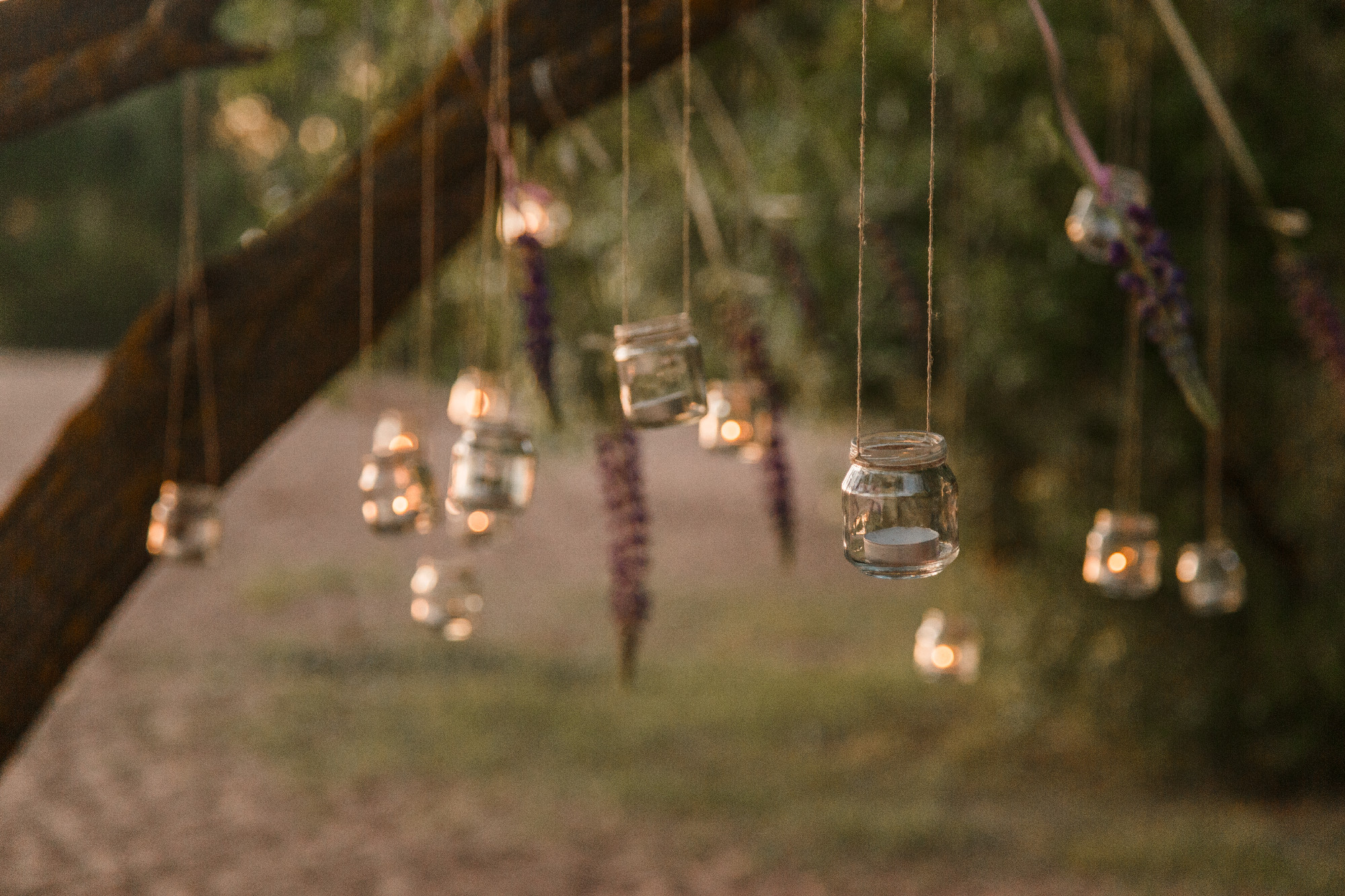 mason jar candle hanging on tree for wedding decor