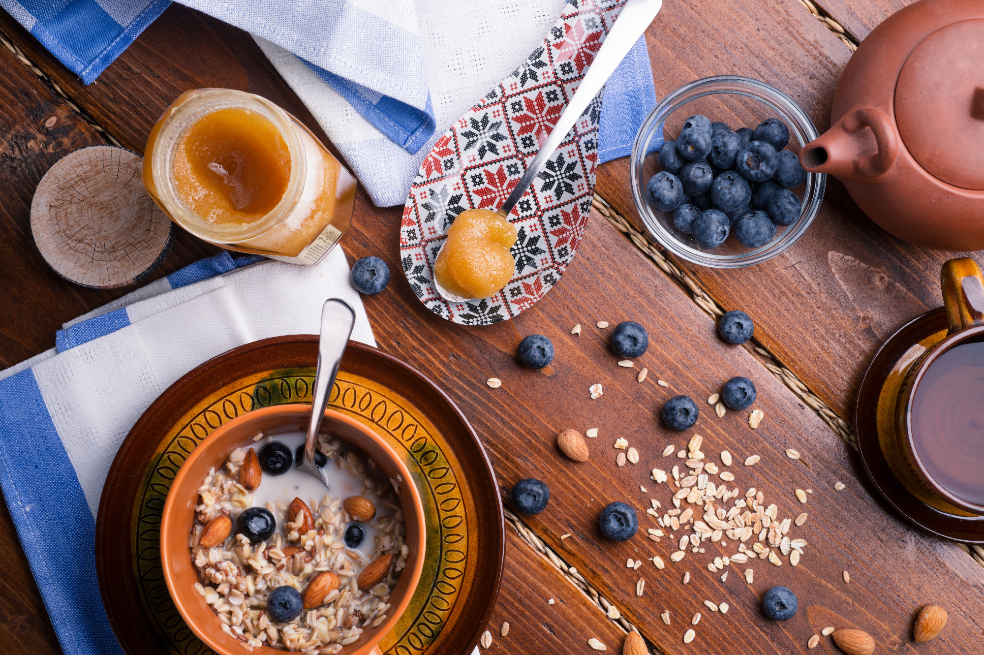 breakfast with oatmeal porridge with blueberries, fruits, almon
