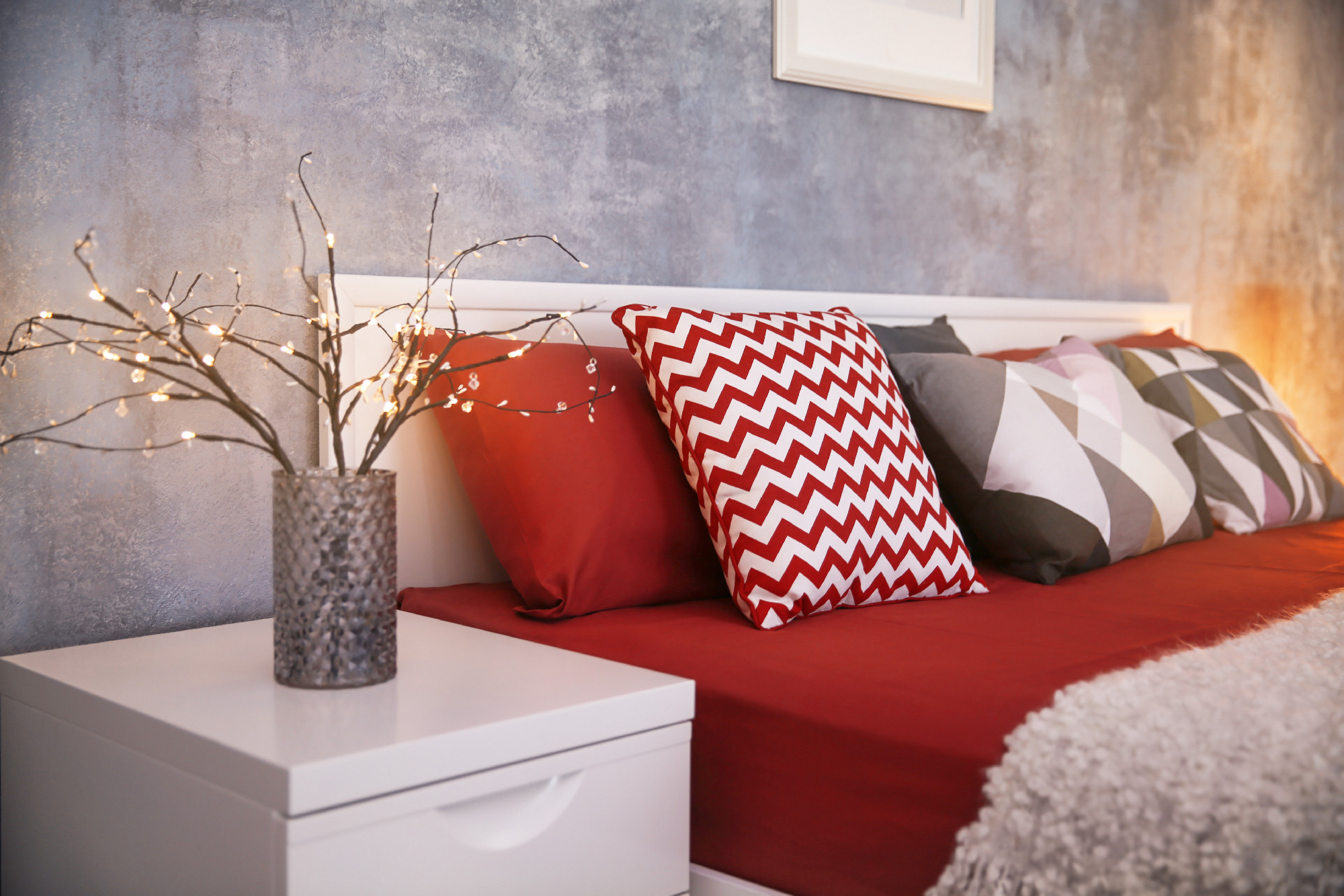 Comfortable bed with pillows in room�