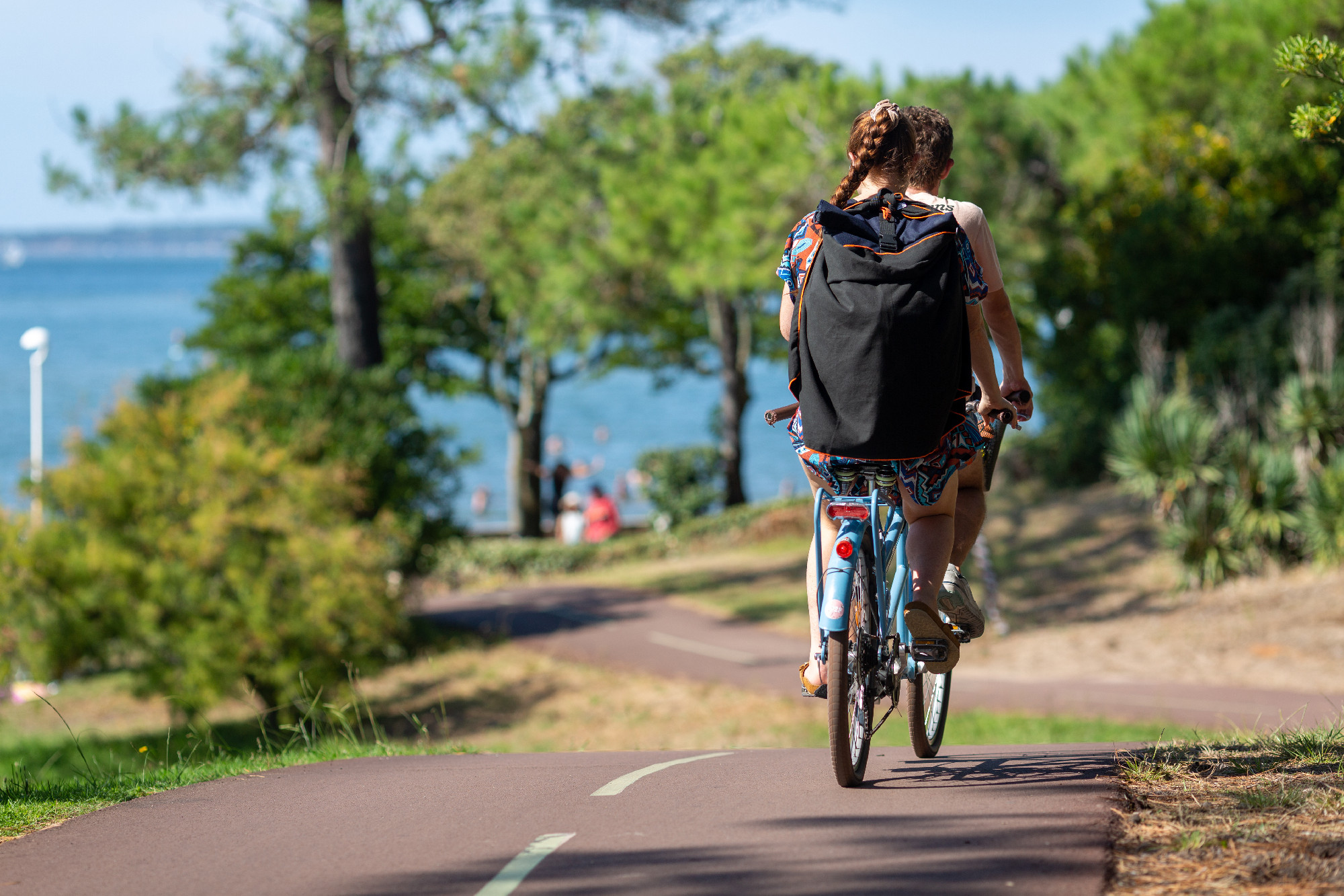Person riding a bicycle on a cycle path