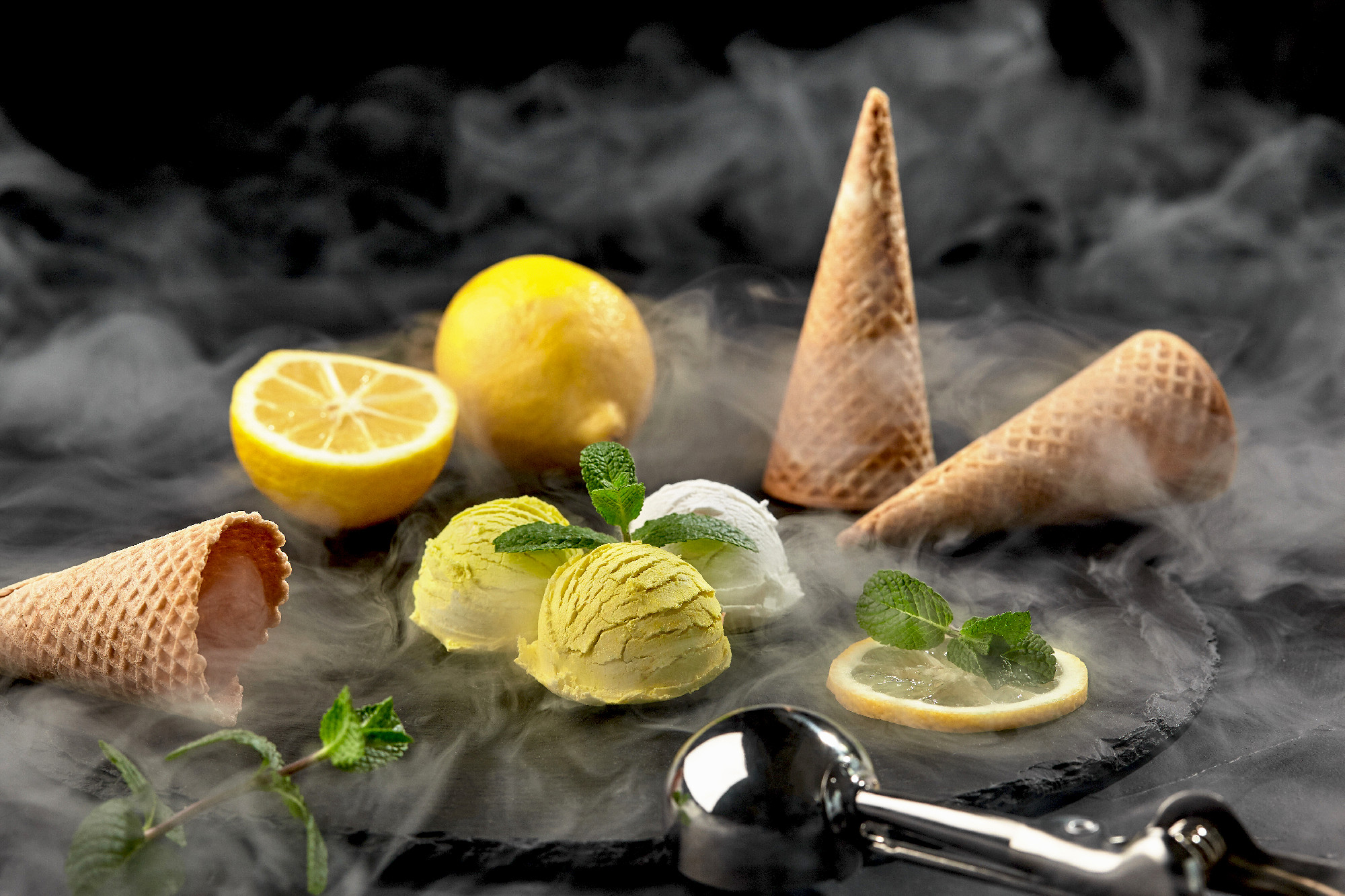 Tasty creamy and lemon ice cream decorated with mint served in s