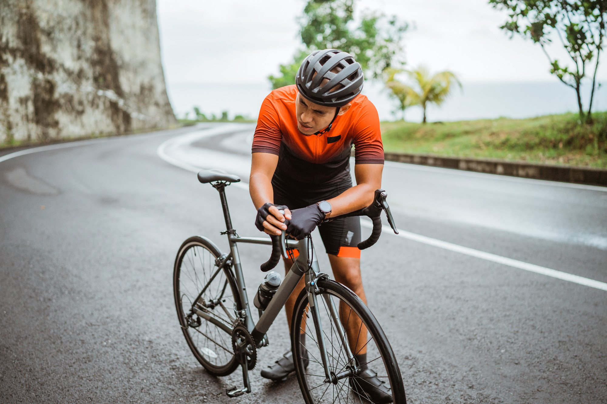 tired cyclist while riding his bike outdoor