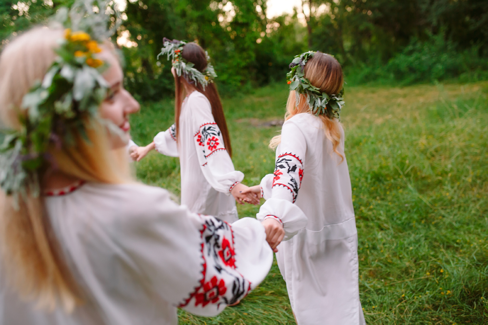 Midsummer. Young people in Slavic clothes revolve around a fire in the Midsummer