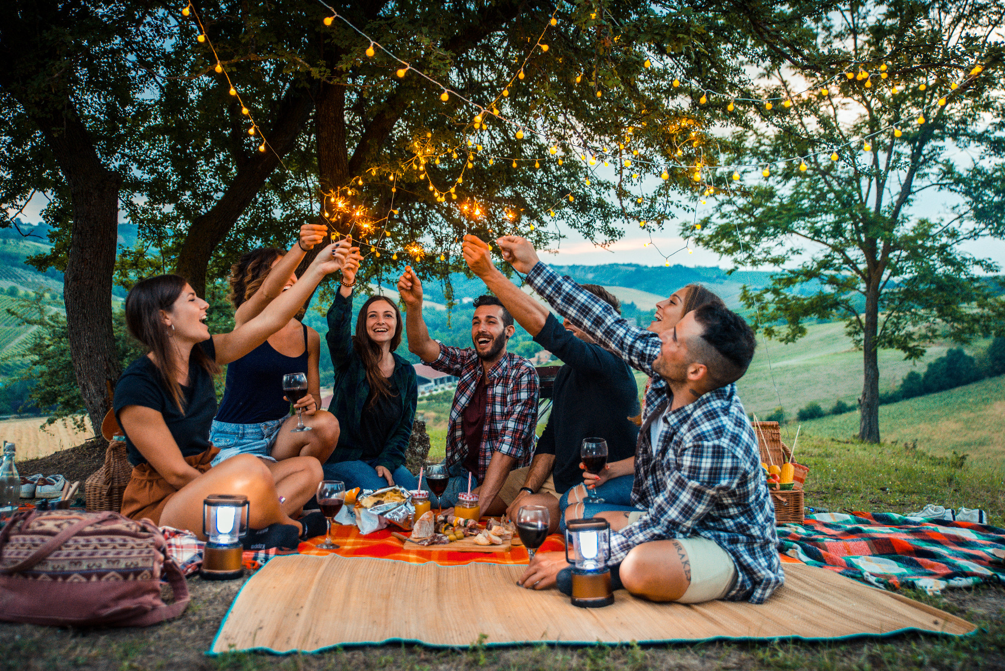 Group of friends eating in the nature