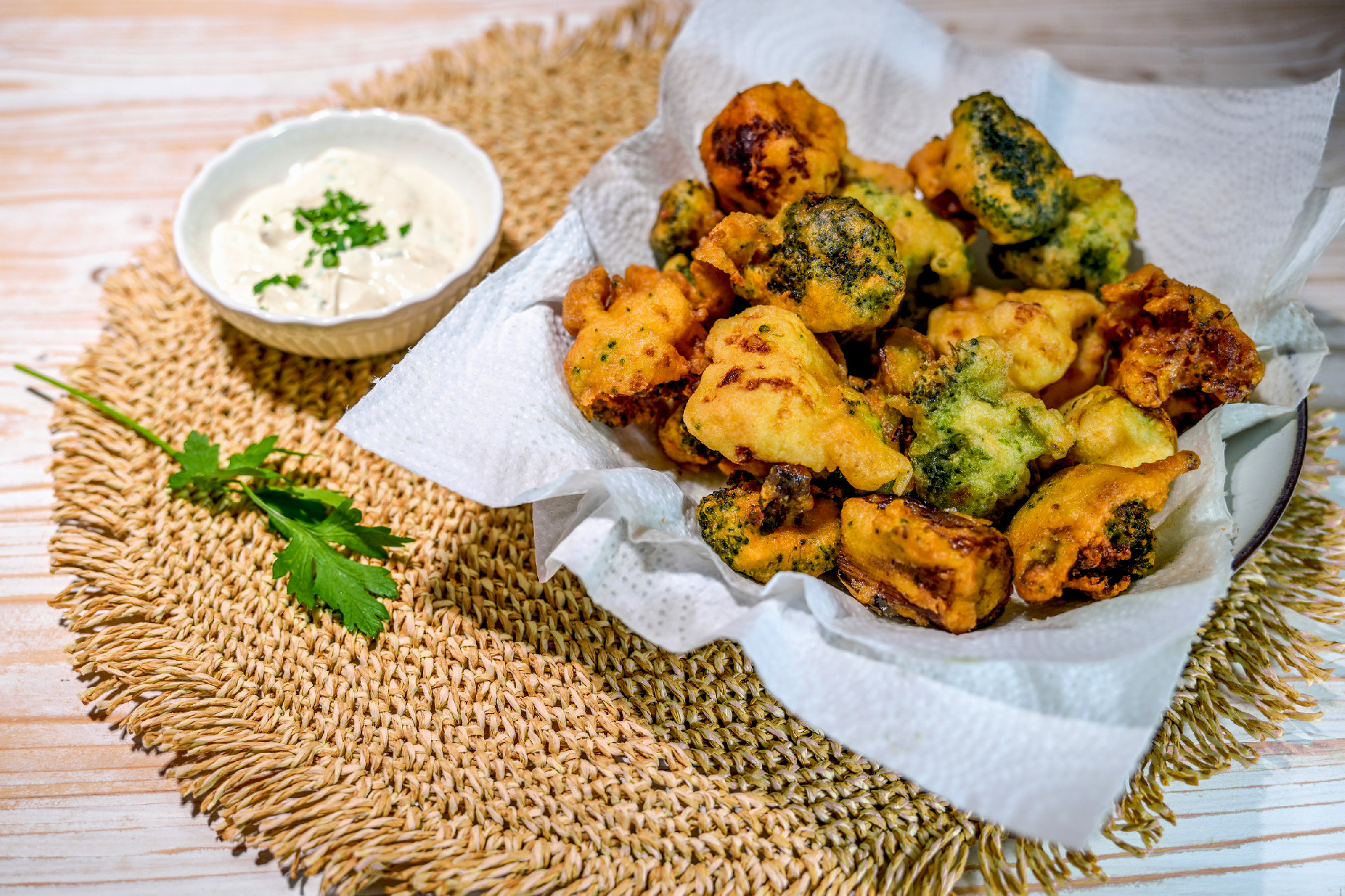 Crispy vegetables such as broccoli and cauliflower deep-fried in