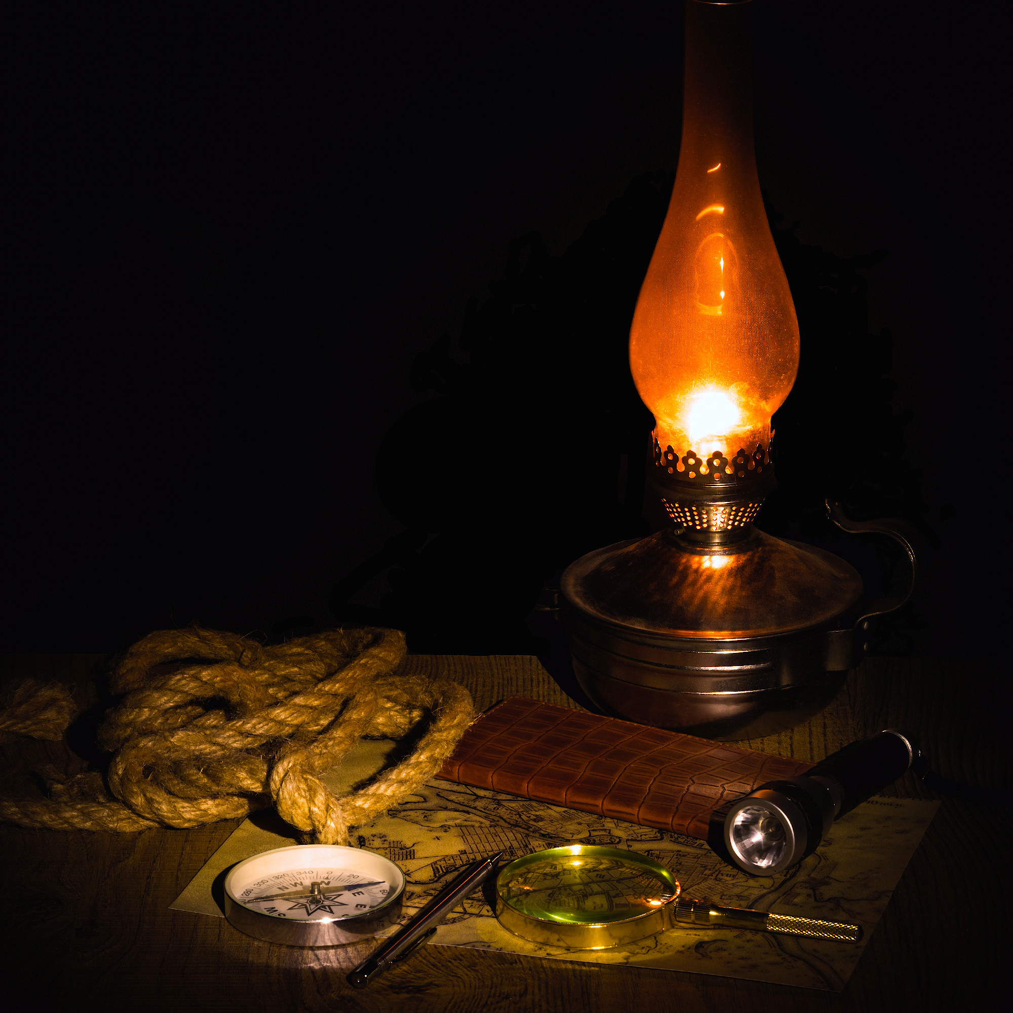 preparation for travel on an old map with a compass a dark background