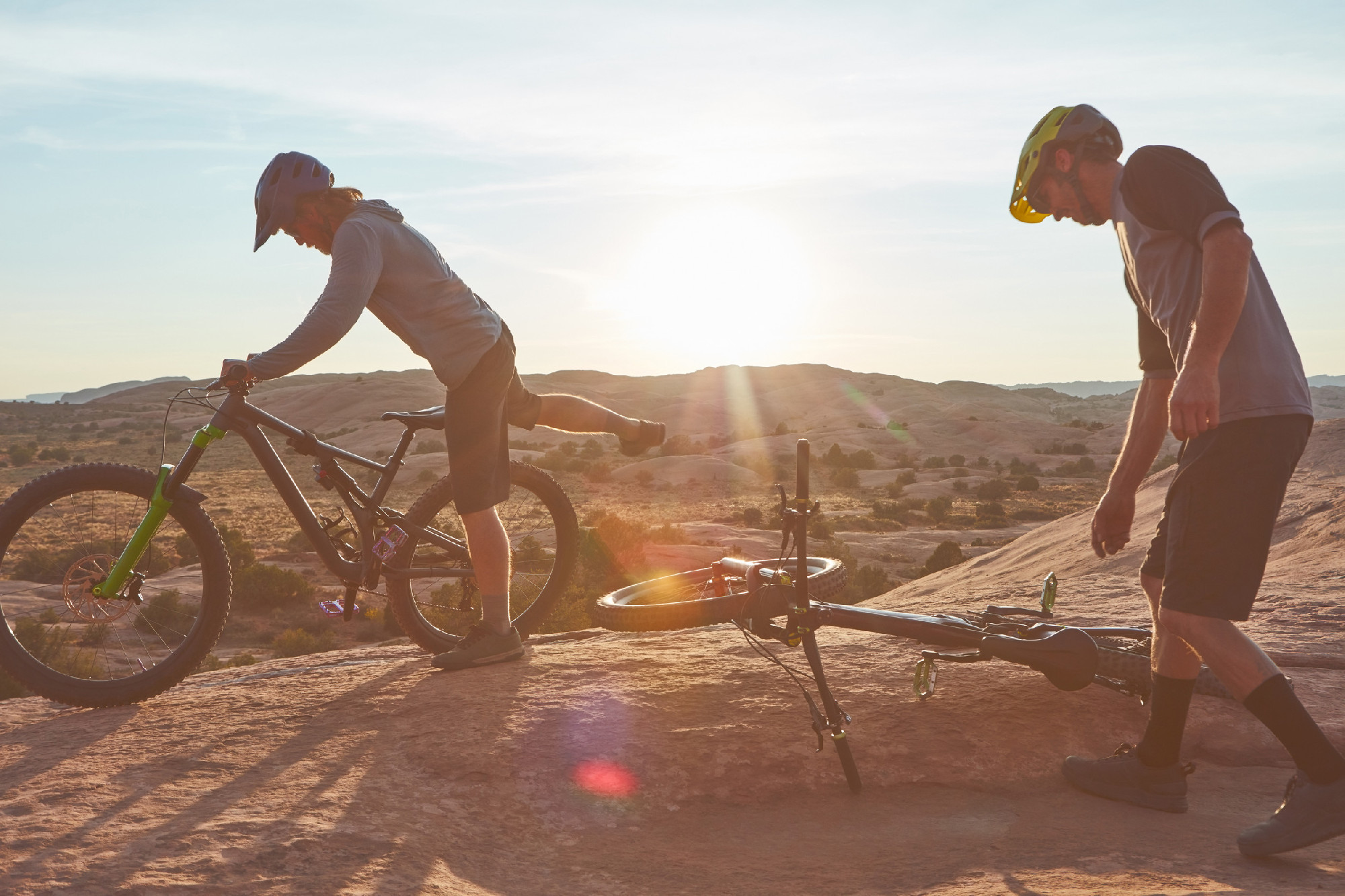 En route to fitness. Full length shot of two young male athletes mountain biking in the wilderness.
