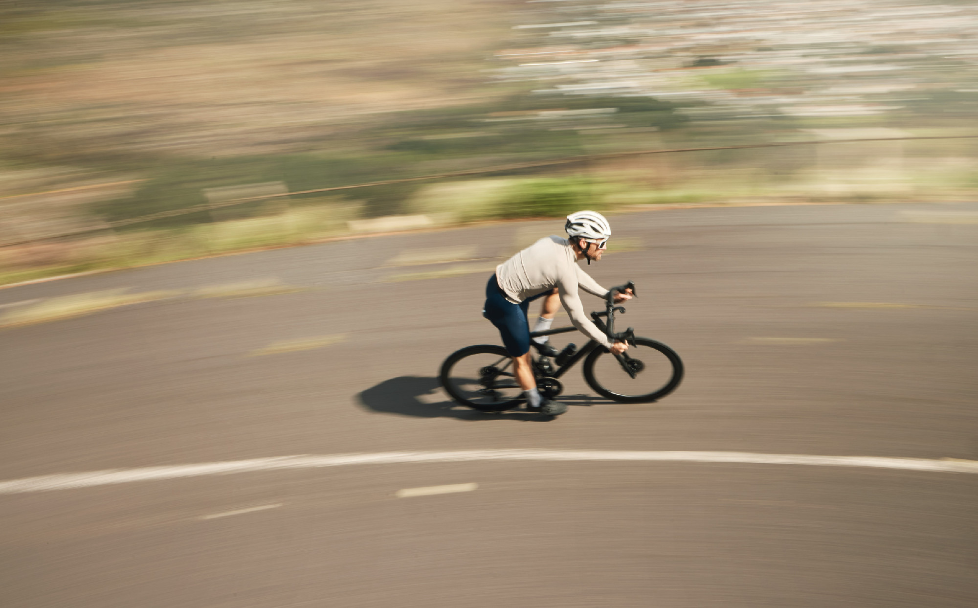 Ripping up the road. High angle shot of a handsome mature man cycling outdoors.