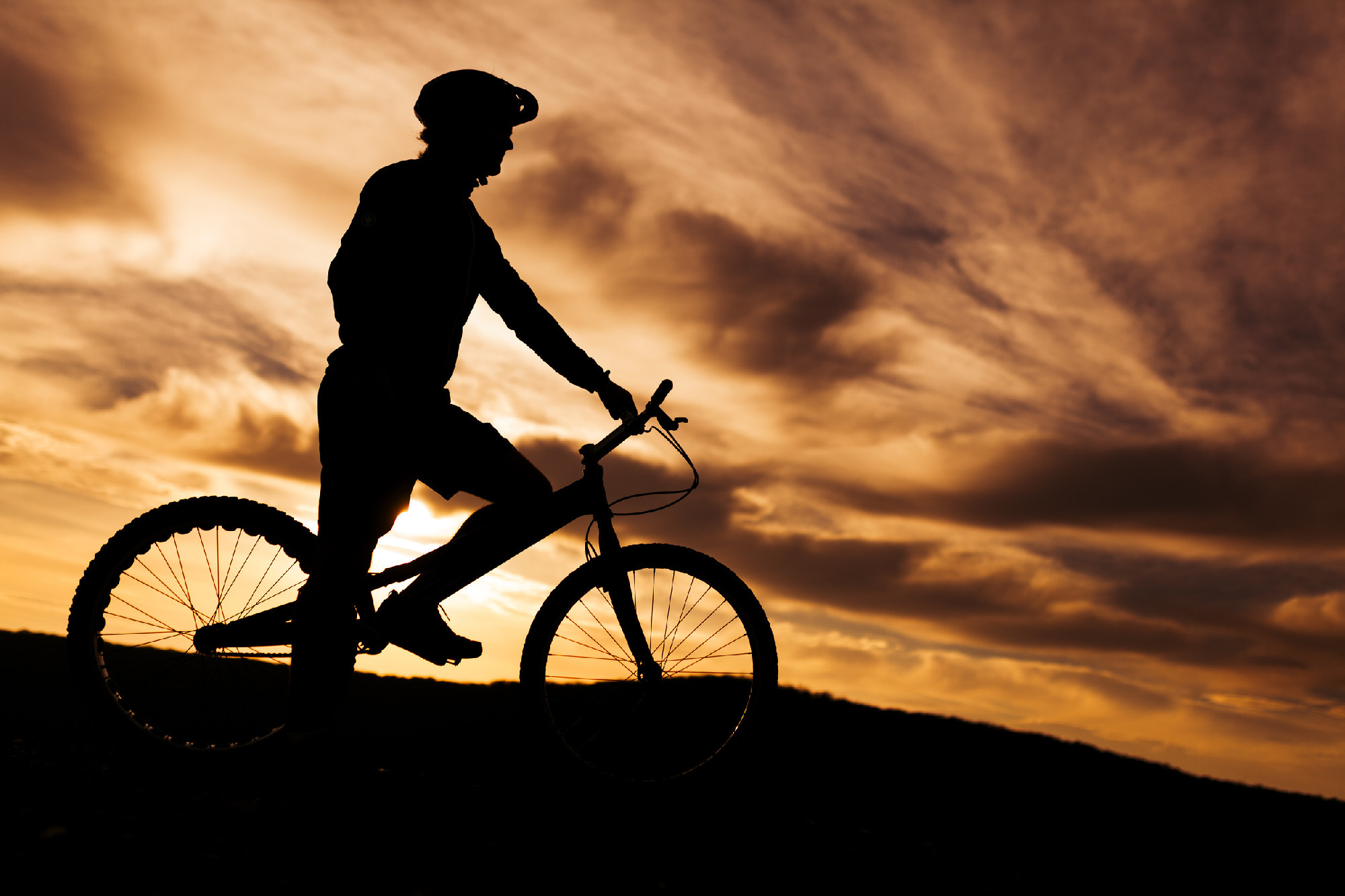 Silhouette of bike sportsman